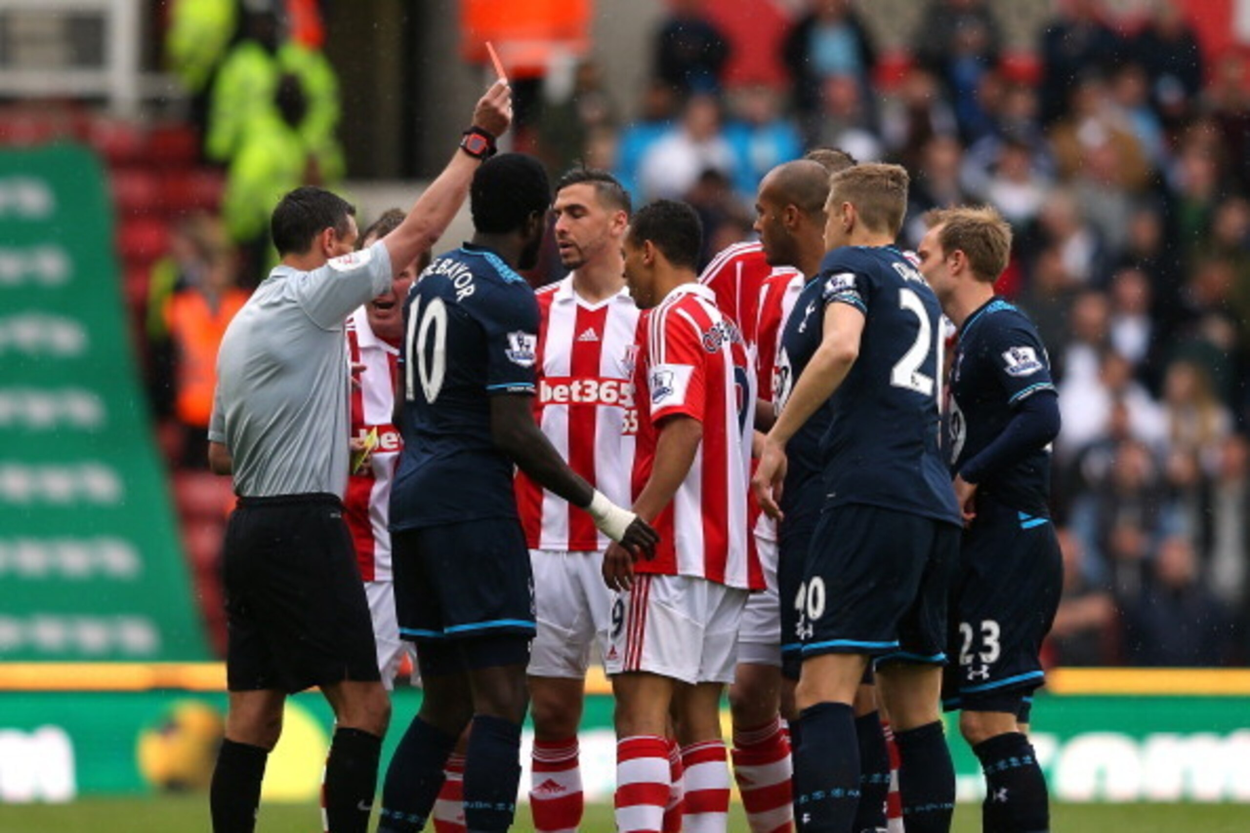 STOKE ON TRENT, ENGLAND - APRIL 26:  Ryan Shawcross of Stoke City (hidden) is sent off by referee Andre Marriner during the Barclays Premier League match between Stoke City and Tottenham Hotspur at the Britannia Stadium on April 26, 2014 in Stoke on Trent