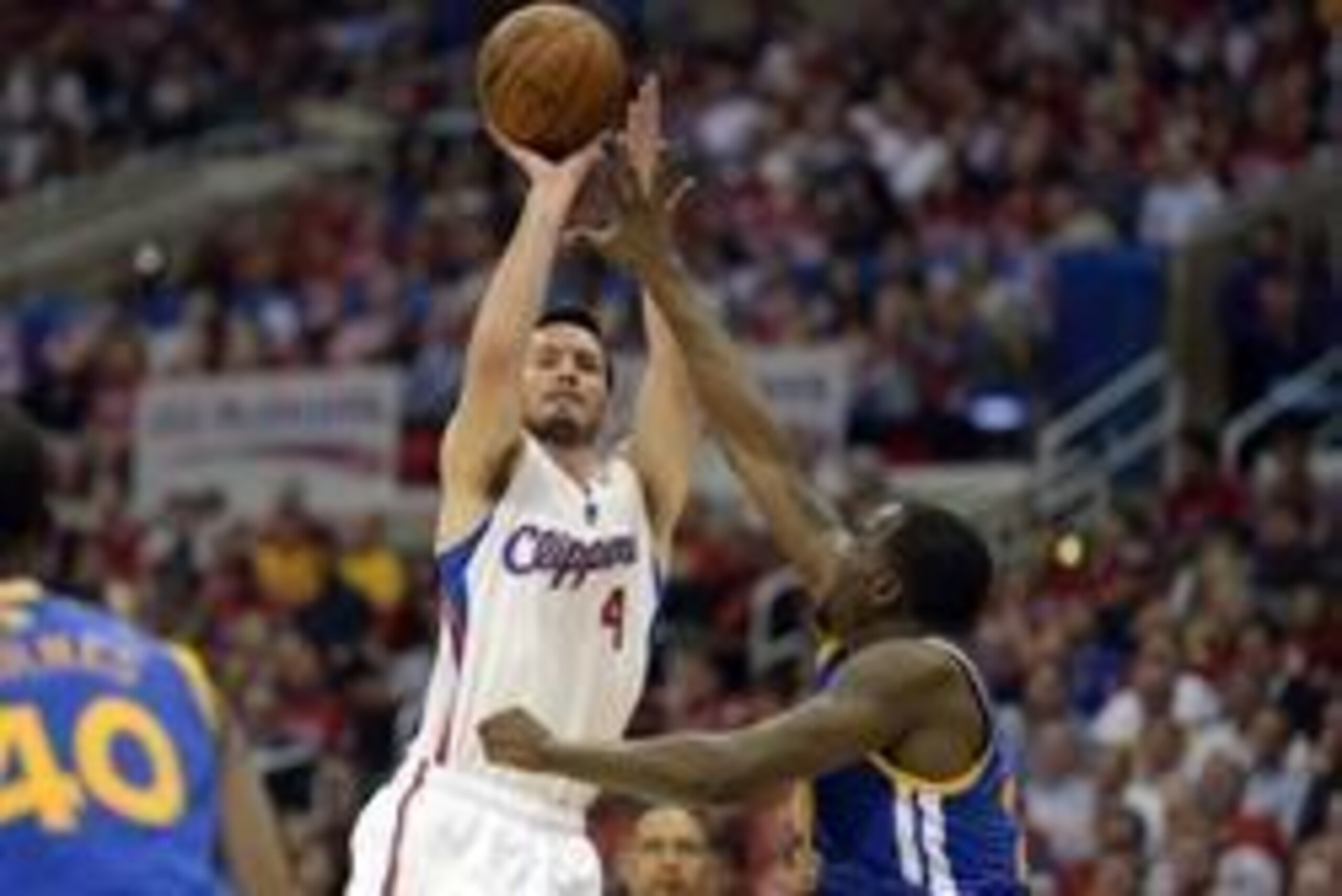 Apr 21, 2014; Los Angeles, CA, USA; Los Angeles Clippers guard J.J. Redick (4) shoots over Golden State Warriors forward Draymond Green (23) during the third quarter in game two during the first round of the 2014 NBA Playoffs at Staples Center. Mandatory