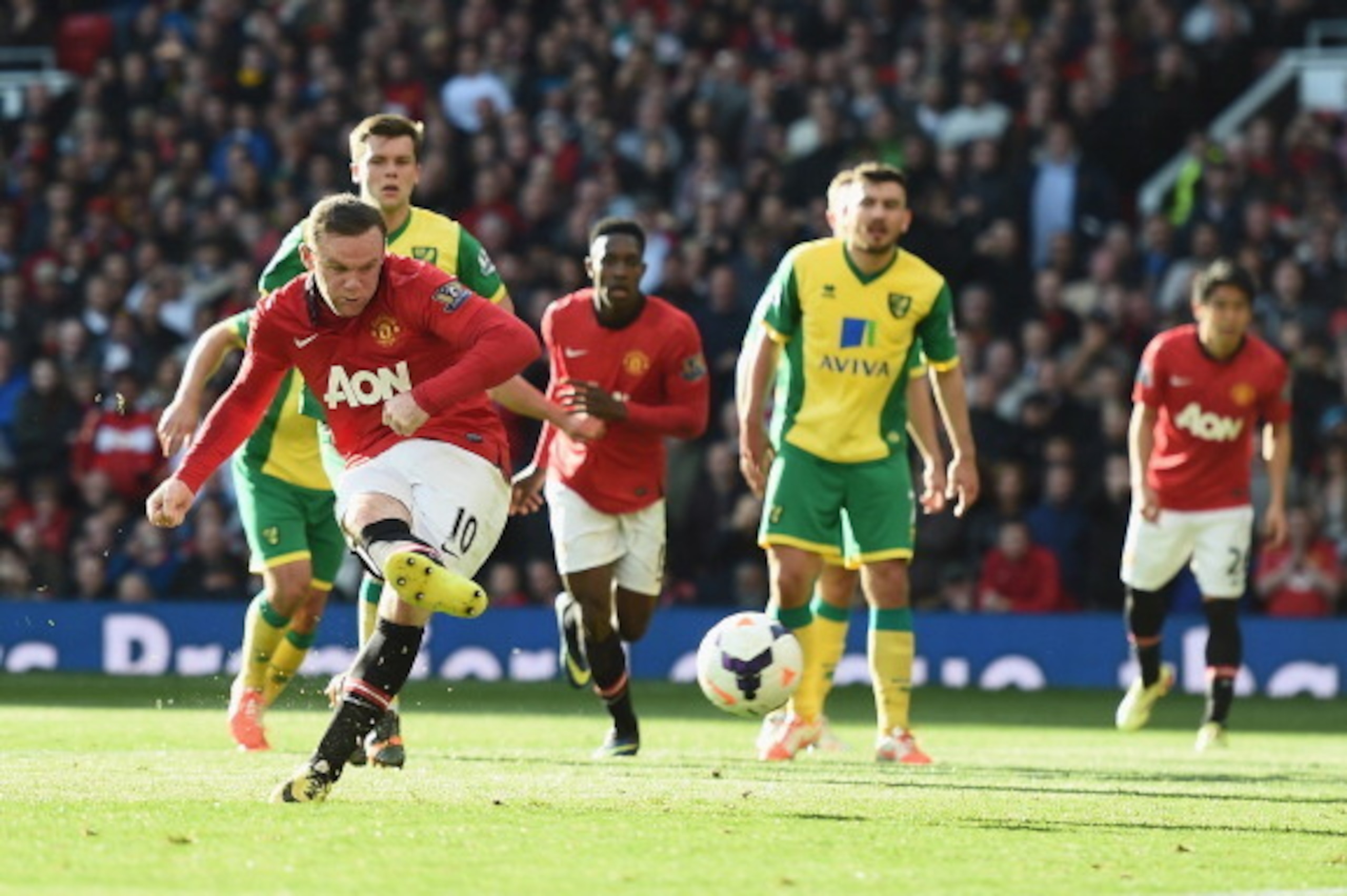 MANCHESTER, ENGLAND - APRIL 26:  Wayne Rooney of Manchester United scores a first half penalty during the Barclays Premier League match between Manchester United and Norwich City at Old Trafford on April 26, 2014 in Manchester, England.  (Photo by Laurenc