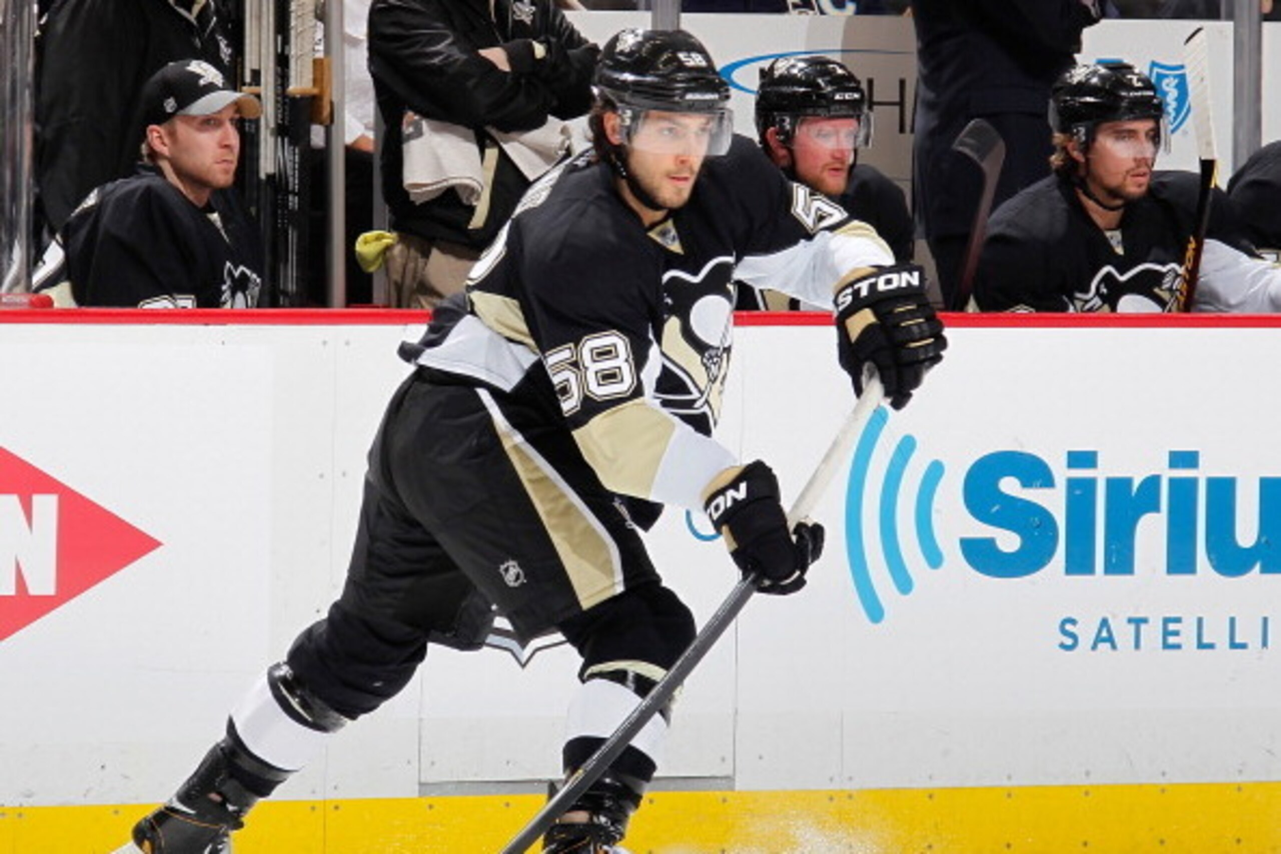 PITTSBURGH, PA - APRIL 19:  Kris Letang #58 of the Pittsburgh Penguins moves the puck against the Columbus Blue Jackets in Game Two of the First Round of the 2014 Stanley Cup Playoffs at Consol Energy Center on April 19, 2014 in Pittsburgh, Pennsylvania. 