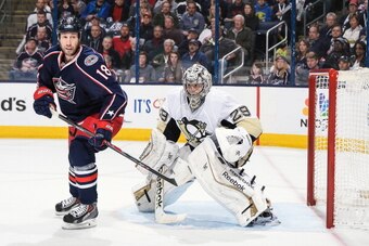 COLUMBUS, OH - APRIL 23:  R.J. Umberger #18 of the Columbus Blue Jackets skate in front of goaltender Marc-Andre Fleury #29 of the Pittsburgh Penguins in Game Four of the First Round of the 2014 Stanley Cup Playoffs on April 23, 2014 at Nationwide Arena i
