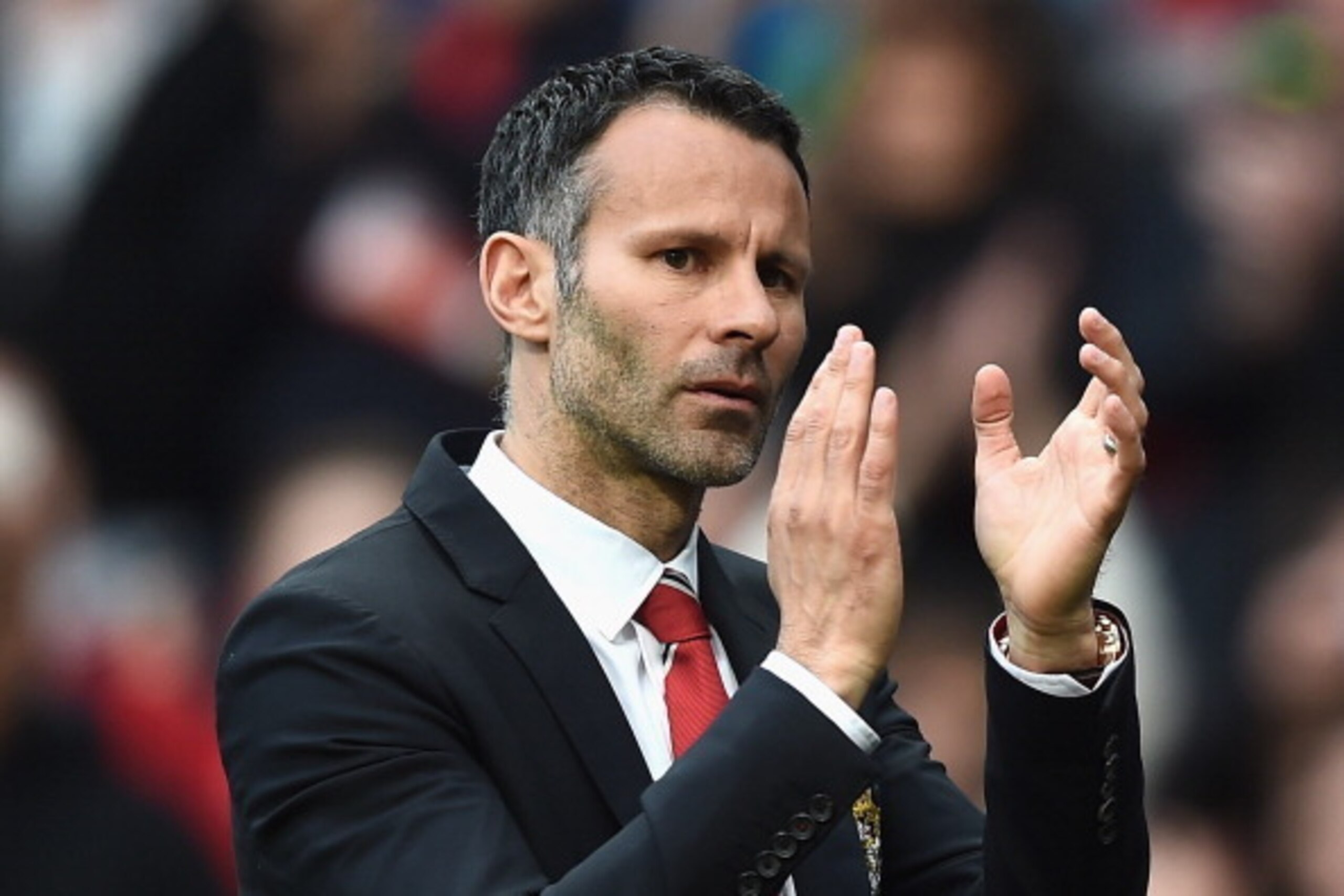 MANCHESTER, ENGLAND - APRIL 26:  Ryan Giggs of Manchester United applauds the fans after a rousing victory in his first match as manager during the Barclays Premier League match between Manchester United and Norwich City at Old Trafford on April 26, 2014 