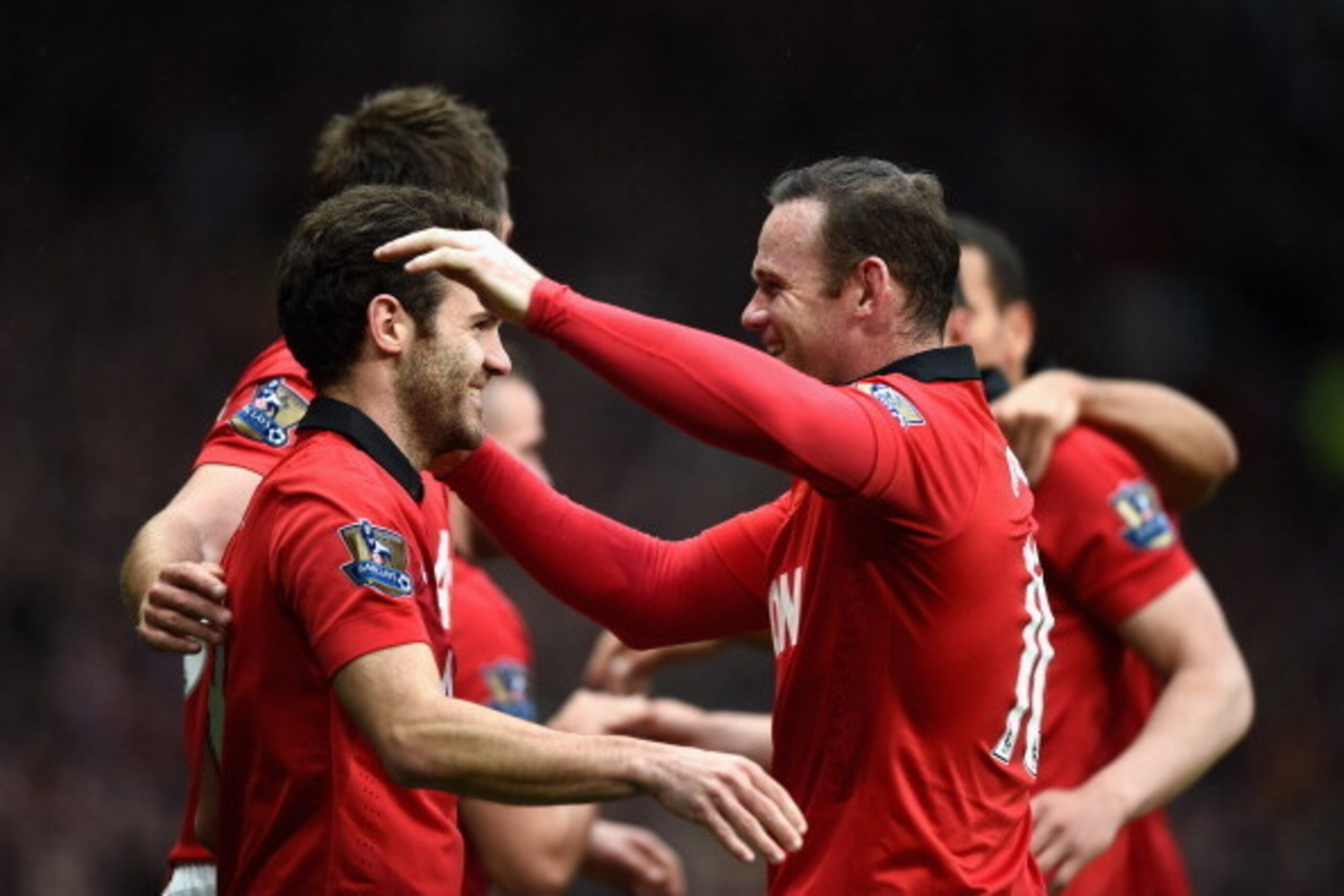 MANCHESTER, ENGLAND - APRIL 26: Juan Mata of Manchester United celebrates the fourth goal with Wayne Rooney during the Barclays Premier League match between Manchester United and Norwich City at Old Trafford on April 26, 2014 in Manchester, England. (Pho MANCHESTER, ENGLAND - APRIL 26: Juan Mata of Manchester United celebrates the fourth goal with Wayne Rooney during the Barclays Premier League match between Manchester United and Norwich City at Old Trafford on April 26, 2014 in Manchester, England. (Pho