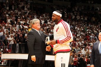 MIAMI, FL - OCTOBER 29: Owner Micky Arison presents LeBron James #6 of the Miami Heat with his ring during the ceremony before the game against the Chicago Bulls on October 29, 2013 at American Airlines Arena in Miami, Florida. NOTE TO USER: User expressl