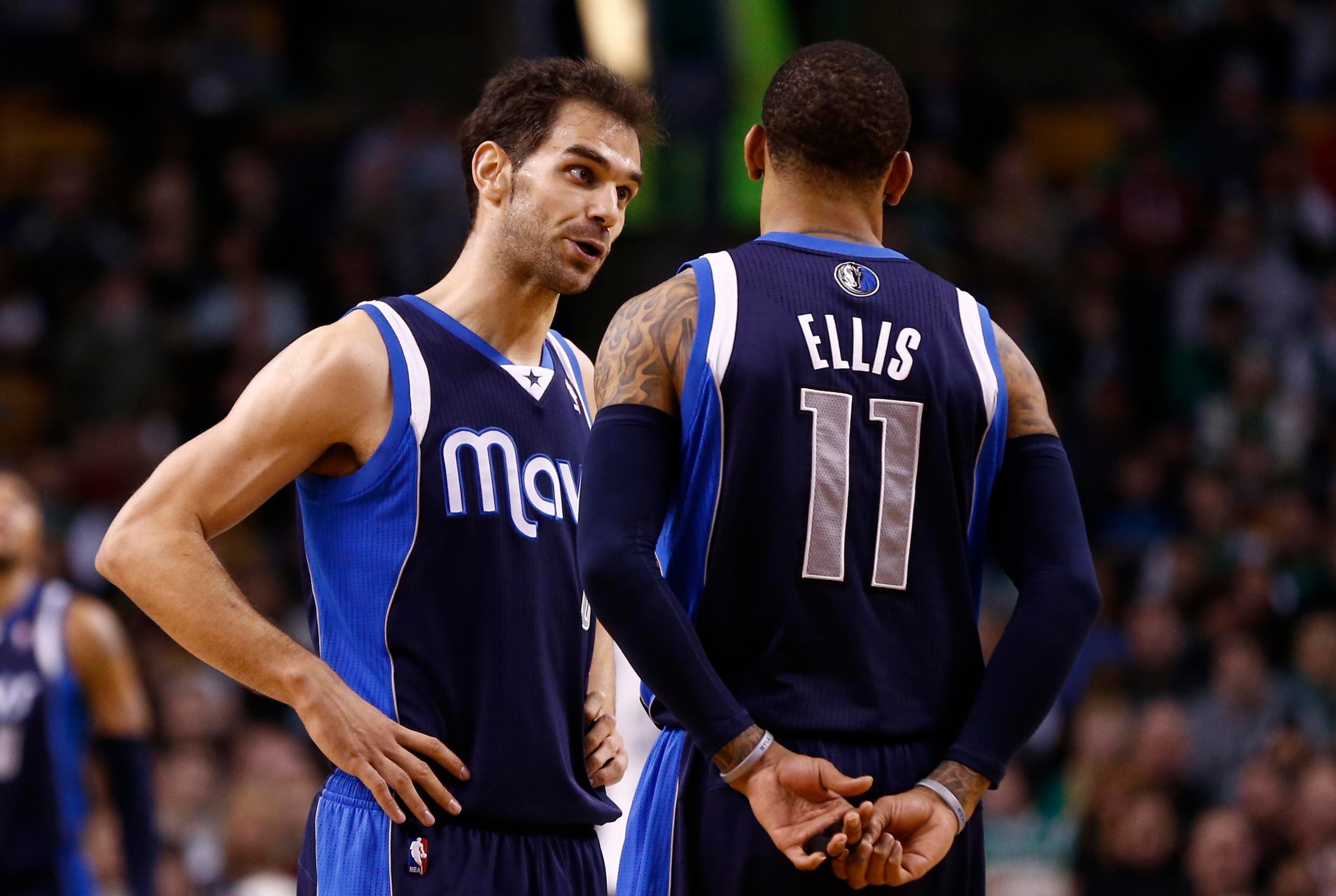 Feb 9, 2014; Boston, MA, USA; Dallas Mavericks point guard Jose Calderon (left) and shooting guard Monta Ellis (11) speak during the second half of a game against the Boston Celtics at TD Garden. Mandatory Credit: Mark L. Baer-USA TODAY Sports