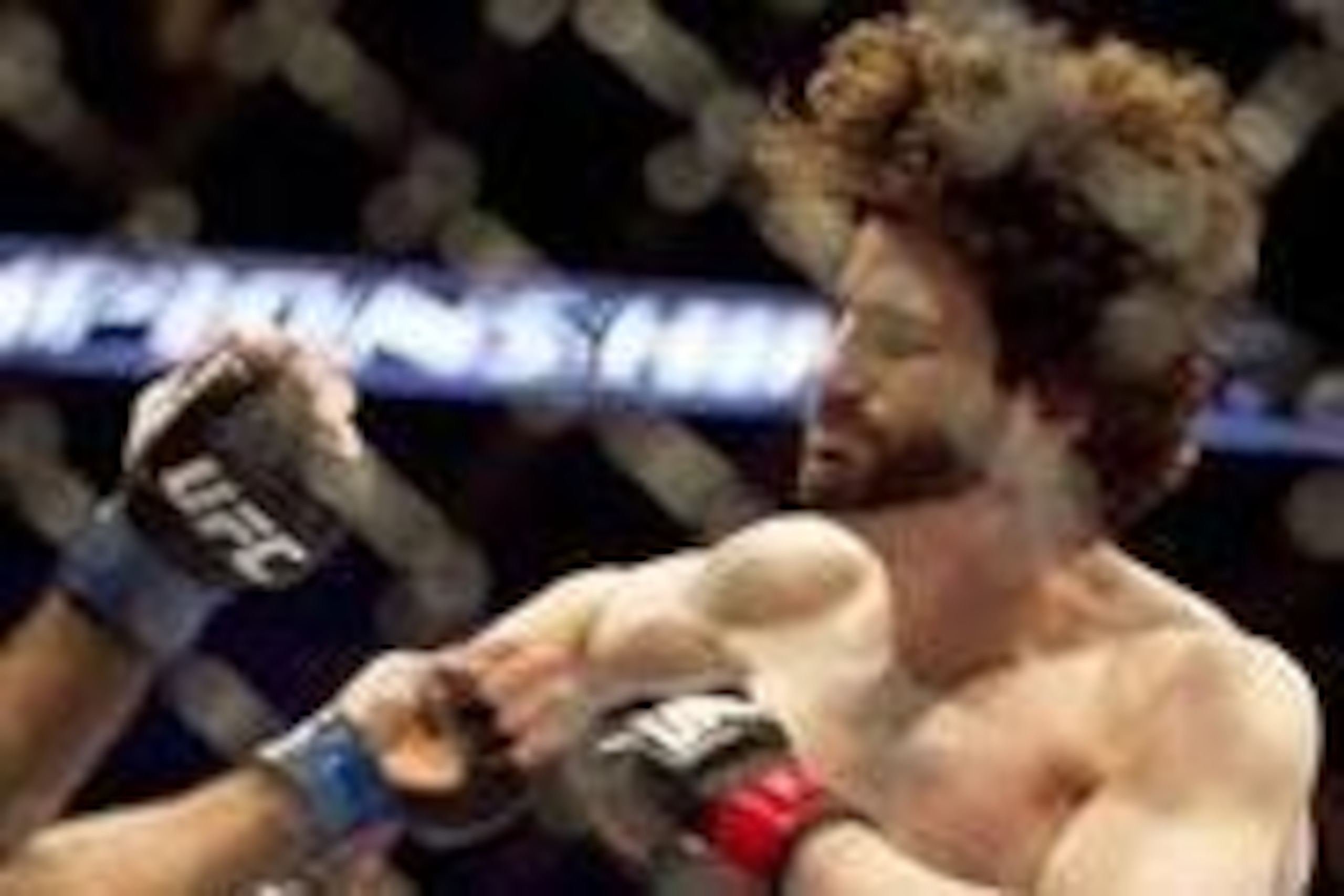 Jan 15, 2014; Duluth, GA, USA; Beneil Dariush (blue gloves) fights Charlie Brenneman (red gloves) during UFC Fight Night at Gwinnett Center. Dariush won. Mandatory Credit: Joshua S. Kelly-USA TODAY Sports