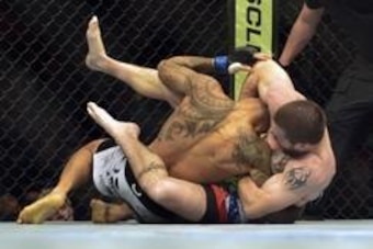Apr 26, 2014; Baltimore, MD, USA;  Jim Miller (red gloves) fights Yancy Medeiros (blue gloves) during their fight in UFC 172 at Baltimore Arena. Mandatory Credit: Tommy Gilligan-USA TODAY Sports