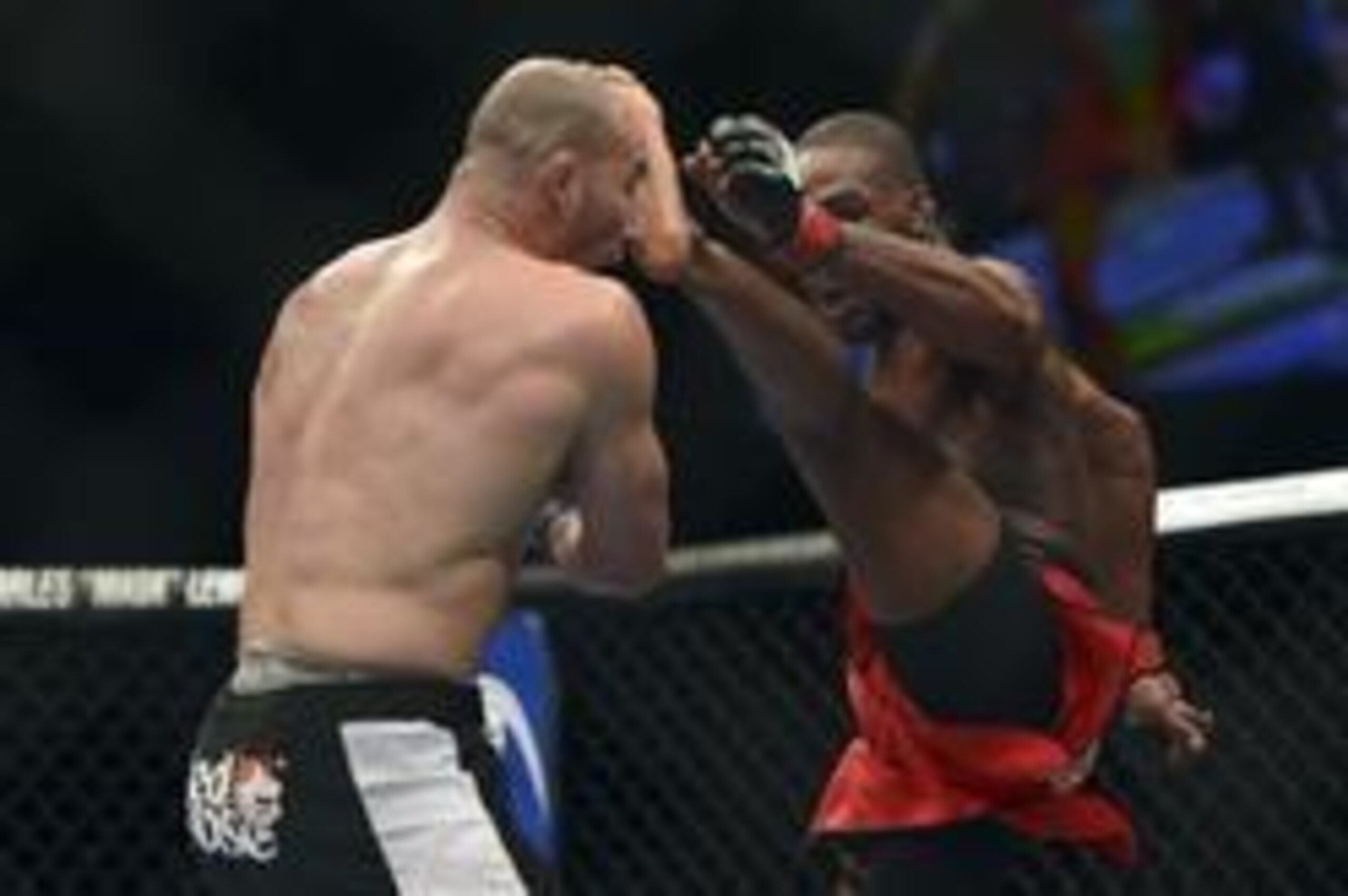Apr 26, 2014; Baltimore, MD, USA;  Jon Jones kicks Glover Teixeira in the head during the UFC light heavy weight championship fight at  Baltimore Arena. Jones retained the light heavy height championship by defeating  Teixeria.  Mandatory Credit: Tommy Gi