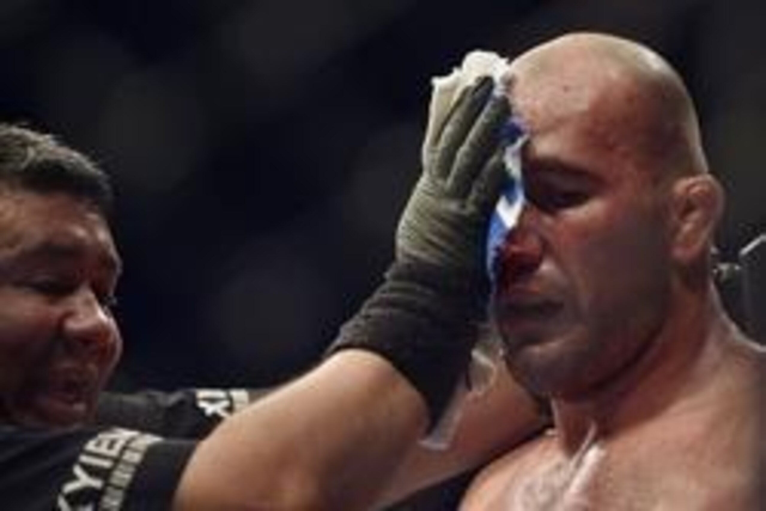 Apr 26, 2014; Baltimore, MD, USA;  Medical staff attend to a cut above the eye of Glover Teixeira during the UFC light heavy weight championship fight against Jon Jones at  Baltimore Arena. Jones retained the light heavy height championship by defeating  