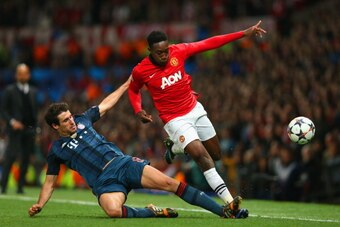 MANCHESTER, ENGLAND - APRIL 01:  Javi Martinez of Bayern Muenchen tackles Danny Welbeck of Manchester United during the UEFA Champions League Quarter Final first leg match between Manchester United and FC Bayern Muenchen at Old Trafford on April 1, 2014 i