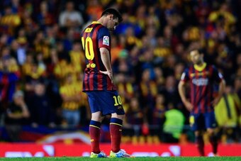 VALENCIA, SPAIN - APRIL 16: Lionel Messi of FC Barcelona looks down dejected after Gareth Bale of Real Madrid CF scored the winning goal during the Copa del Rey Final between Real Madrid and FC Barcelona at Estadio Mestalla on April 16, 2014 in Valencia, 