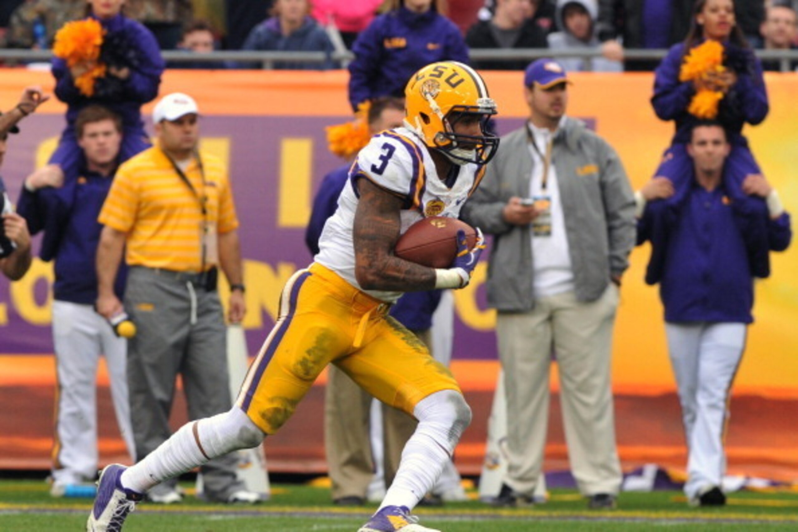 TAMPA, FL -  JANUARY 1:  Wide receiver O'Dell Beckham Jr. #3 of the LSU Tigers runs a kickoff against the Iowa Hawkeyes January 1, 2014  in the Outback Bowl at Raymond James Stadium in Tampa, Florida.  LSU won 21-14.  (Photo by Al Messerschmidt/Getty Imag