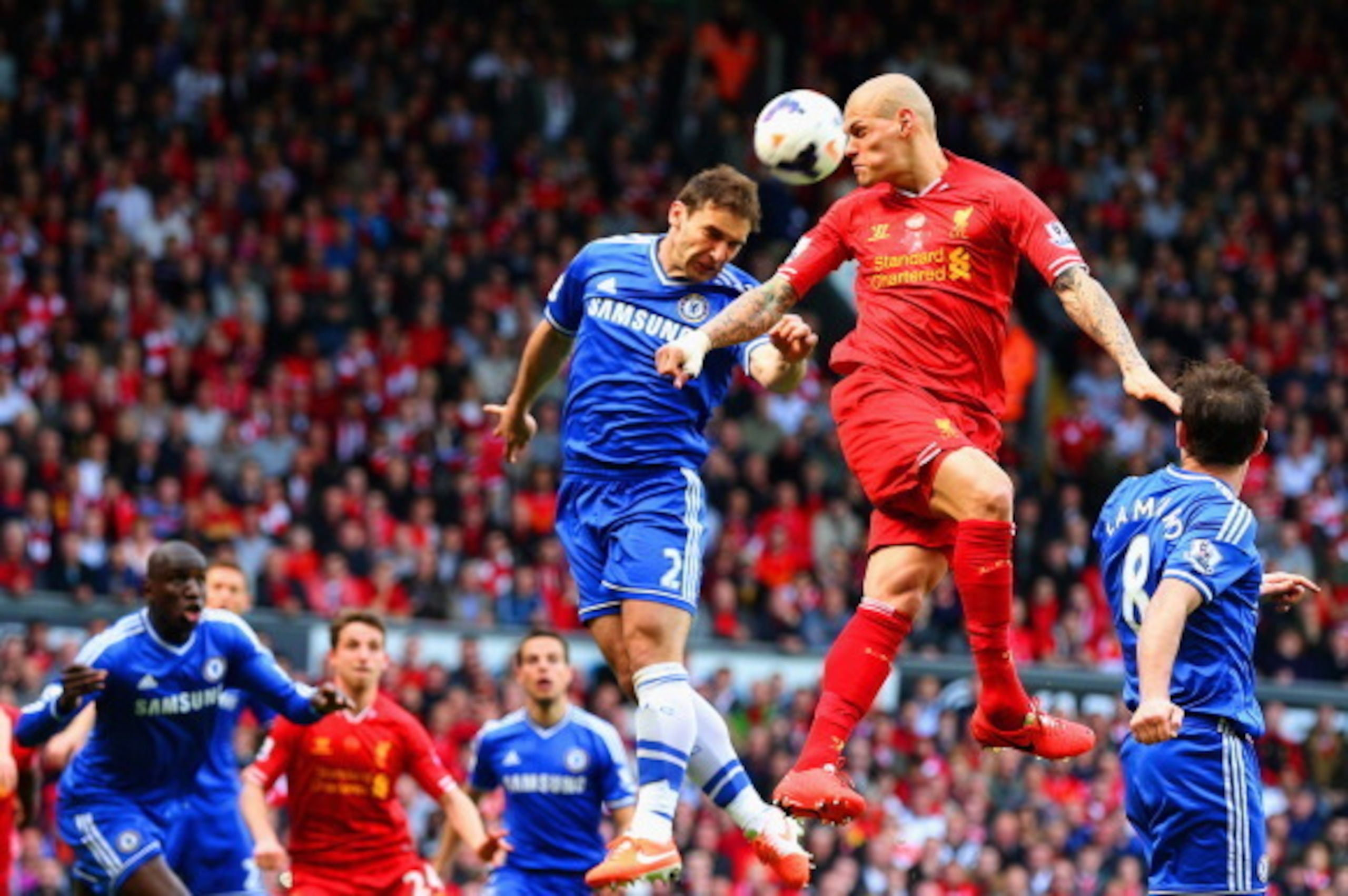 LIVERPOOL, ENGLAND - APRIL 27: Branislav Ivanovic of Chelsea and Martin Skrtel of Liverpool compete for the ball during the Barclays Premier League match between Liverpool and Chelsea at Anfield on April 27, 2014 in Liverpool, England.  (Photo by Clive Br