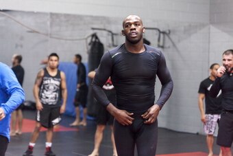 ALBUQUERQUE, NM - APRIL 2: UFC lightweight champion Jon 'Bones' Jones joins in for a warm up during an open training session for fans and media at the Jackson's Mixed Martial Arts and Fitness on April 2, 2014 in Albuquerque, New Mexico. (Photo by Aaron Sw