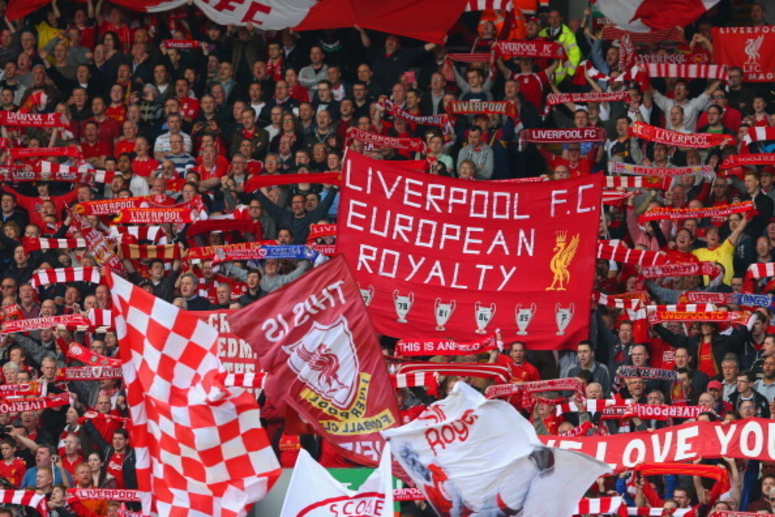 LIVERPOOL, ENGLAND - APRIL 27:  Liverpool fans show their colours during the Barclays Premier League match between Liverpool and Chelsea at Anfield on April 27, 2014 in Liverpool, England.  (Photo by Clive Brunskill/Getty Images)