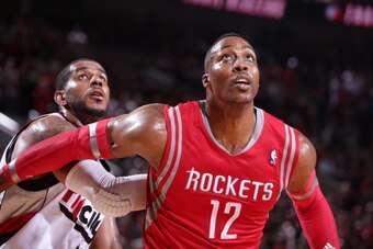 PORTLAND, OR - APRIL 25: Dwight Howard #12 of the Houston Rockets battles for position against LaMarcus Aldridge #12 of the Portland Trail Blazers in Game Three of the Western Conference Quarterfinals during the 2014 NBA Playoffs on April 25, 2014 at the 
