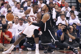 TORONTO, ON - APRIL 22:  Paul Pierce #34 of the Brooklyn Nets battles against Patrick Patterson #54 of the Toronto Raptors in Game Two of the NBA Eastern Conference Play-off at the Air Canada Centre on April 22, 2014 in Toronto, Ontario, Canada. The Rapto