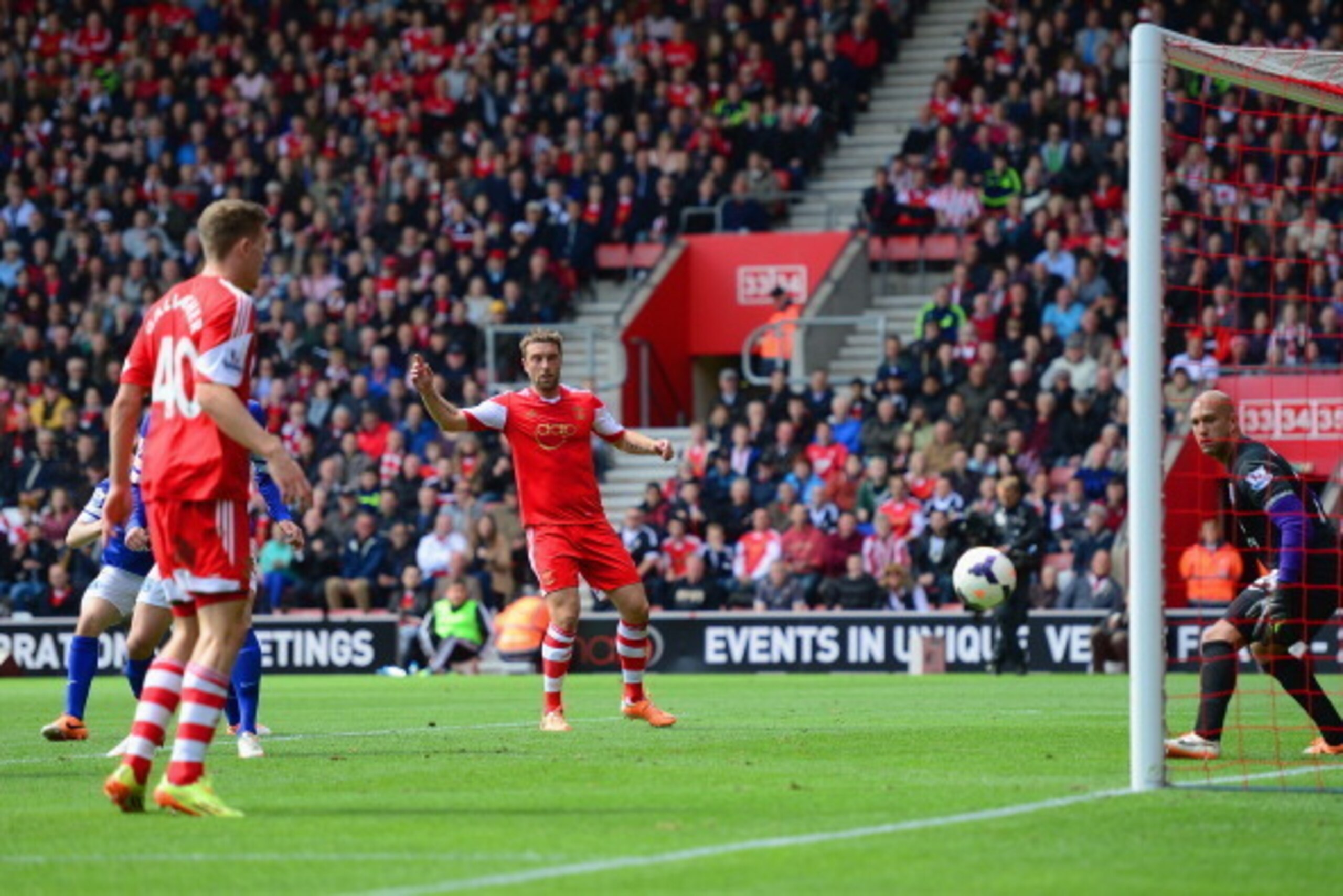 SOUTHAMPTON, ENGLAND - APRIL 26:  Rickie Lambert of Southampton and Tim Howard of Everton look on as Seamus Coleman of Everton (obscured) scores an own goal during the Barclays Premier League match between Southampton and Everton at St Mary's Stadium on A