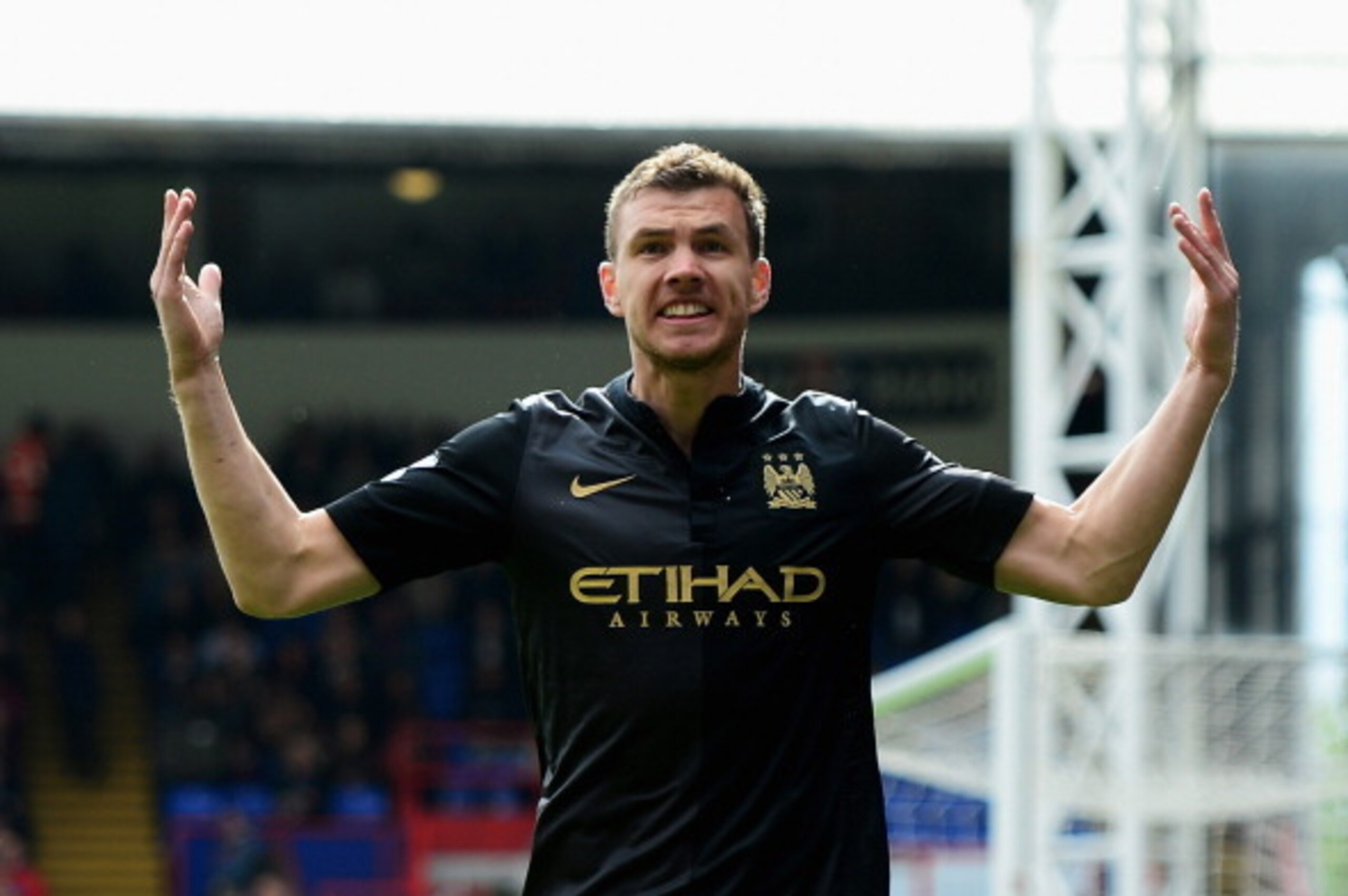 LONDON, ENGLAND - APRIL 27:  Edin Dzeko of Manchester City celebrates scoring the opening goal during the Barclays Premier League match between Crystal Palace and Manchester City at Selhurst Park on April 27, 2014 in London, England.  (Photo by Jamie McDo