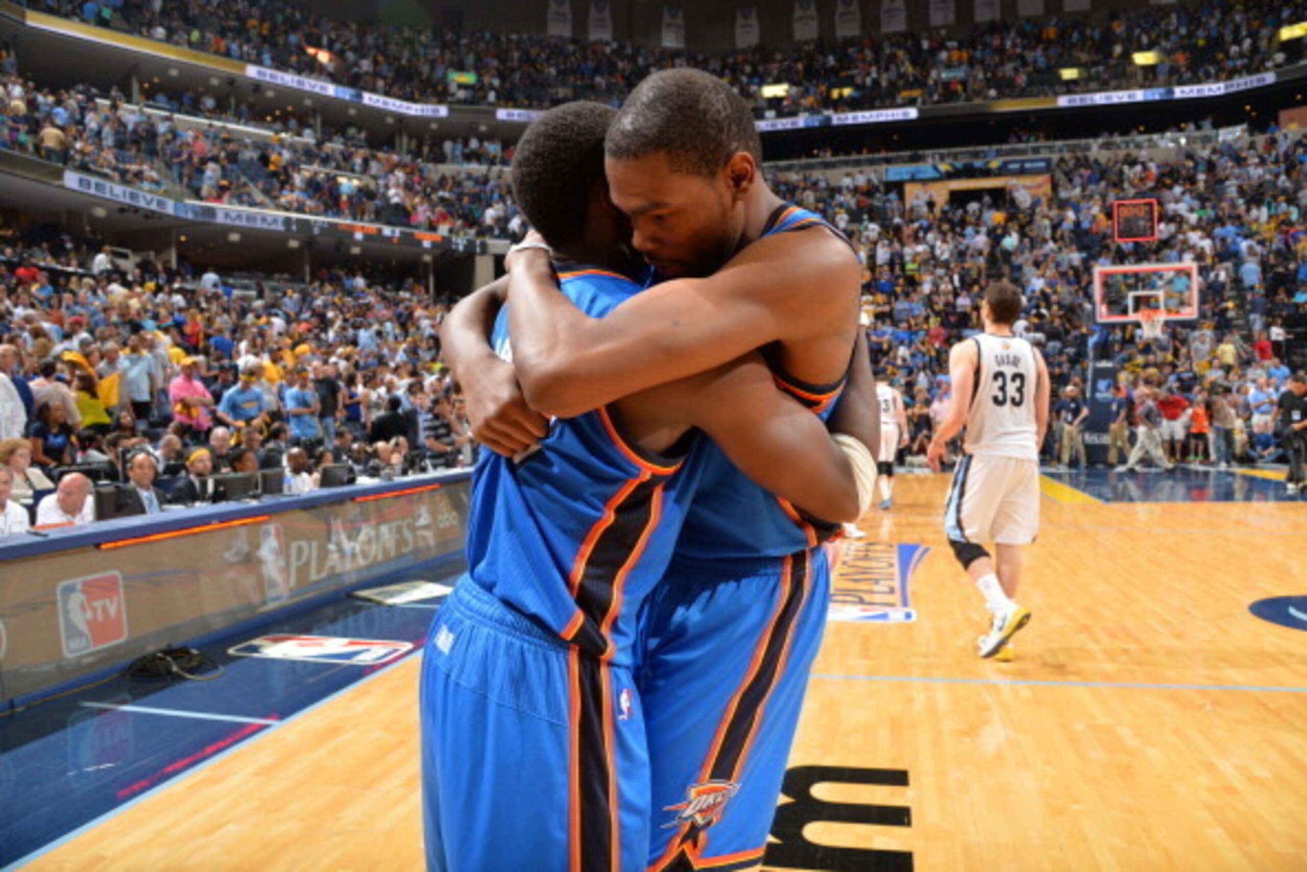 MEMPHIS, TN - APRIL 26: Kevin Durant #35 of the Oklahoma City Thunder hugs his teammate Reggie Jackson #15 against the Memphis Grizzlies Thunder in Game Four of the Western Conference Quarterfinals during the 2014 NBA Playoffs on April 26, 2014 at FedExFo