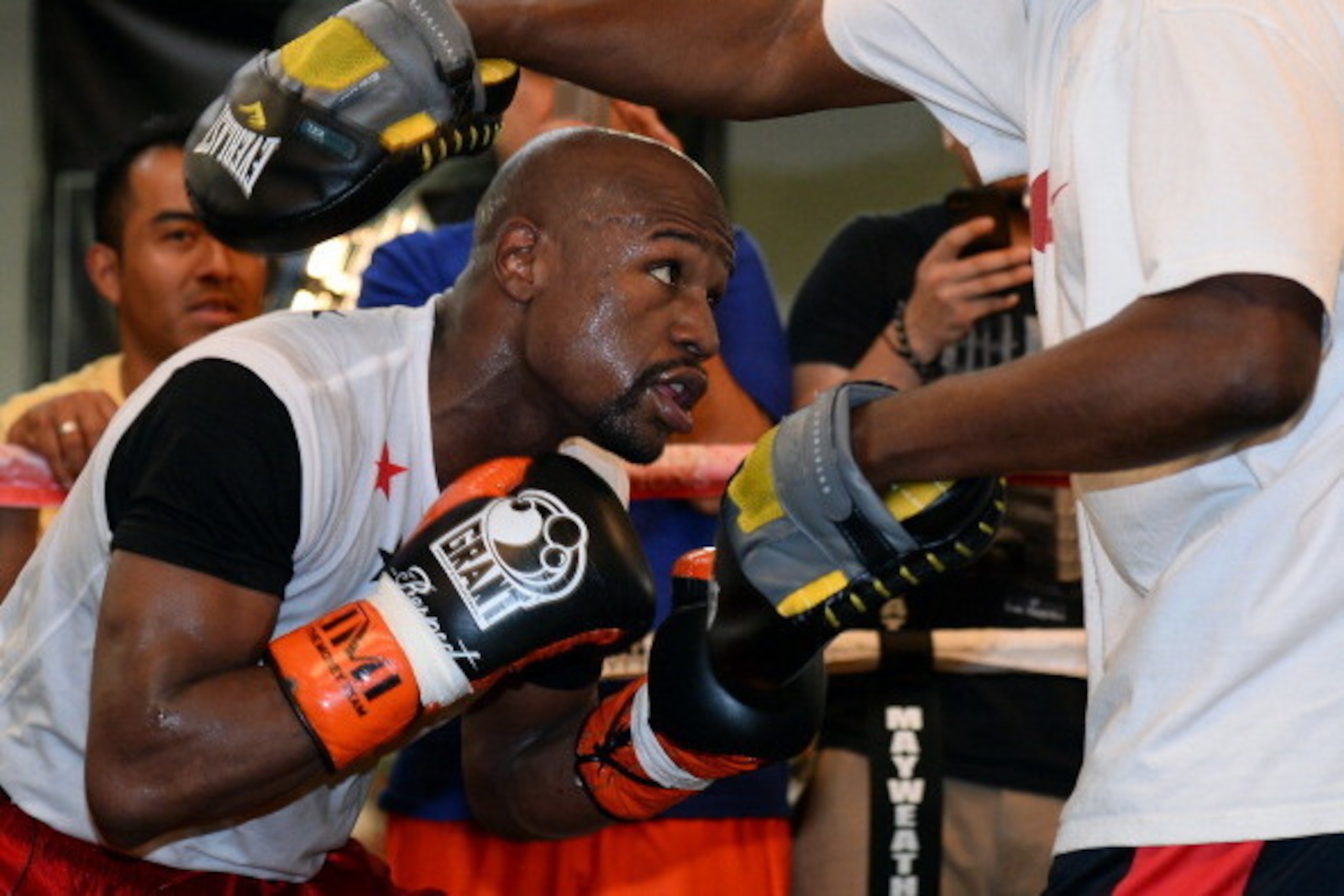 LAS VEGAS, NV - APRIL 22:  Boxer Floyd Mayweather Jr. works out with his trainer and uncle Roger Mayweather at the Mayweather Boxing Club on April 22, 2014 in Las Vegas, Nevada. Mayweather will face Marcos Maidana in a 12-round world championship unificat