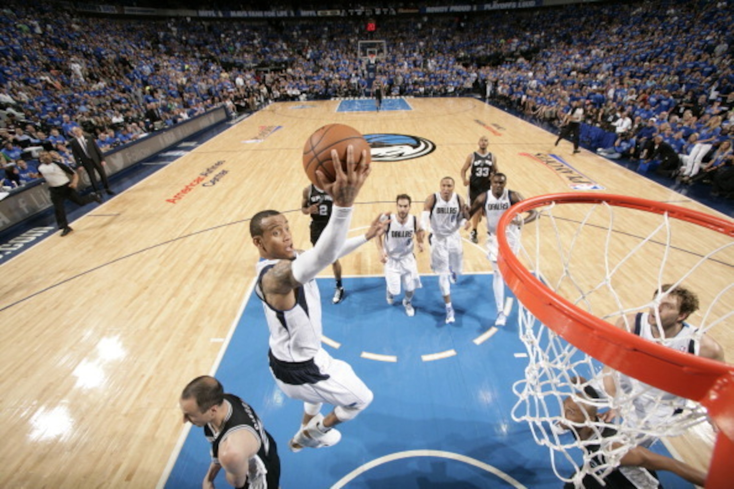 DALLAS, TX - APRIL 26: Monta Ellis #11 of the Dallas Mavericks floats in for the lay up against Manu Ginobili #20 of the San Antonio Spurs during Game Three of the Western Conference Quarterfinals during the 2014 NBA Playoffs on April 26, 2014 at the Amer
