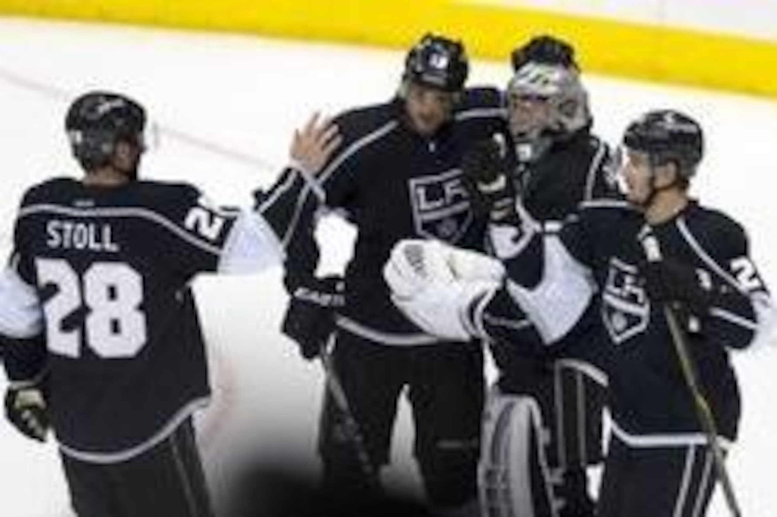 Apr 24, 2014; Los Angeles, CA, USA; Los Angeles Kings right wing Marian Gaborik (12) celebrates with goalie Jonathan Quick (32)and center Jarret Stoll (28) and defenseman Slava Voynov (26) after the game against the San Jose Sharks in game four of the fir