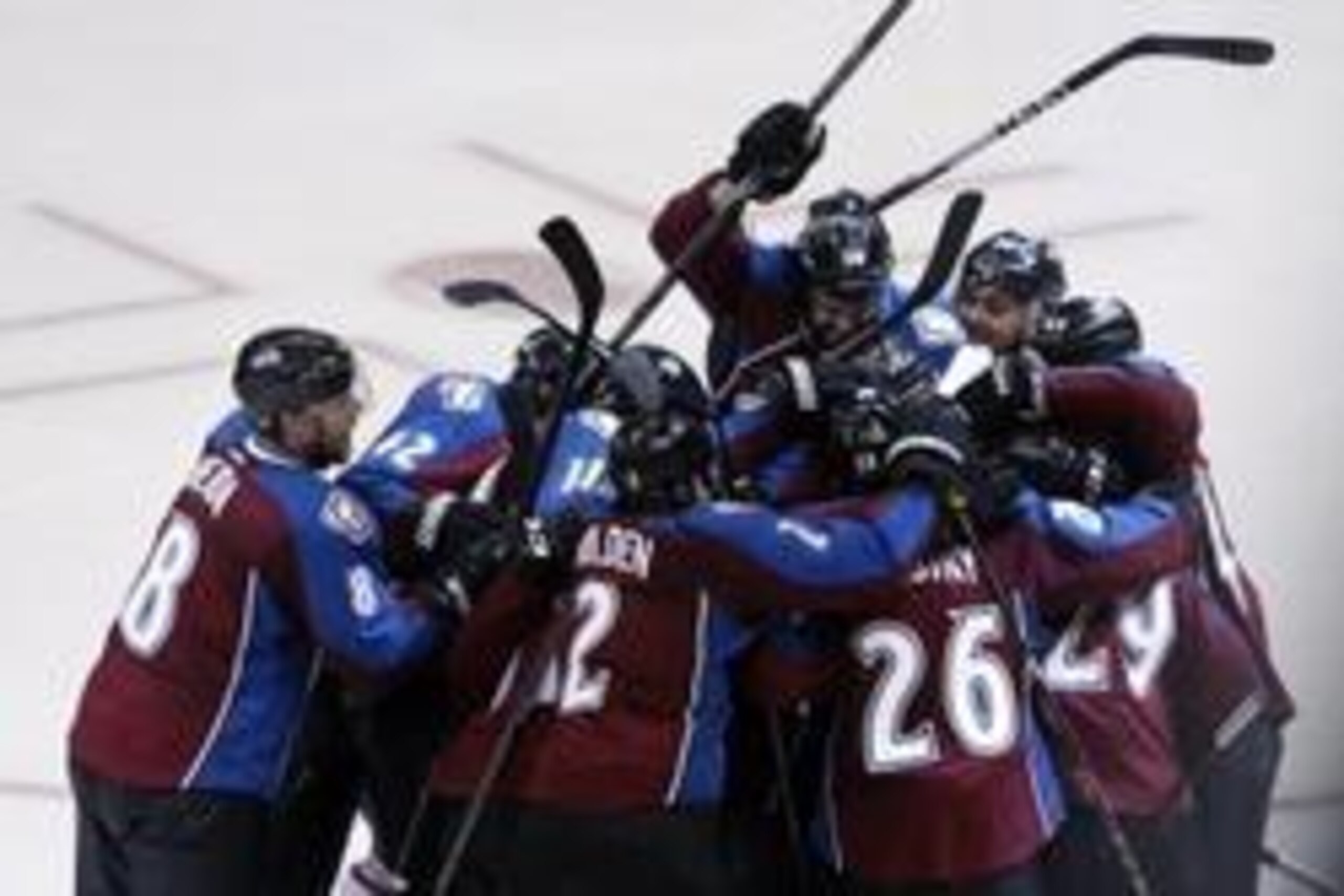 Apr 26, 2014; Denver, CO, USA; Members of the Colorado Avalanche celebrate after forward Nathan MacKinnon (29) scored the game winning goal during the overtime period in game five of the first round of the 2014 Stanley Cup Playoffs against the Minnesota W