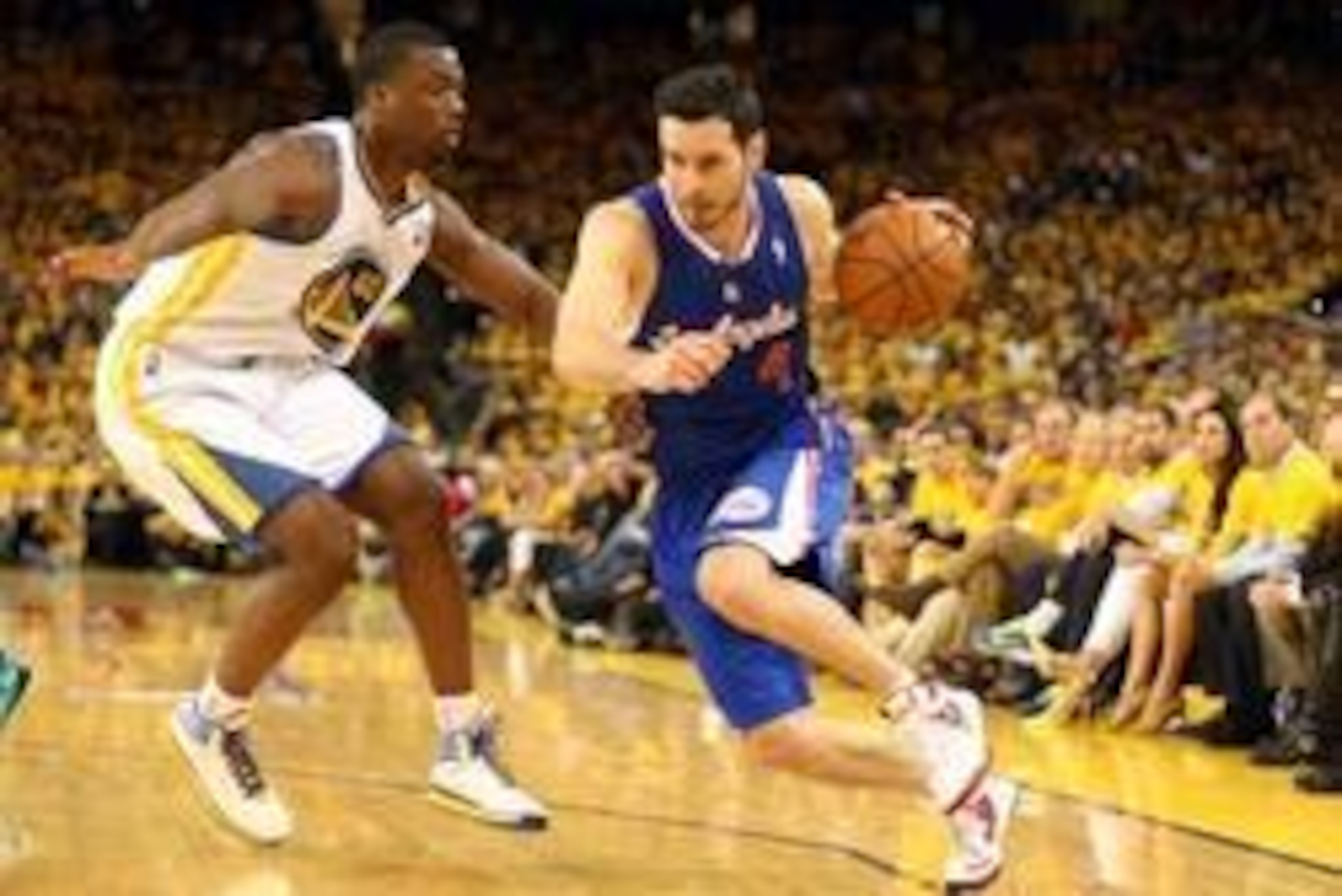 Apr 24, 2014; Oakland, CA, USA; Los Angeles Clippers guard J.J. Redick (4) drives in against Golden State Warriors forward Harrison Barnes (40) during the third quarter of game three of the first round of the 2014 NBA Playoffs at Oracle Arena. The Los Ang