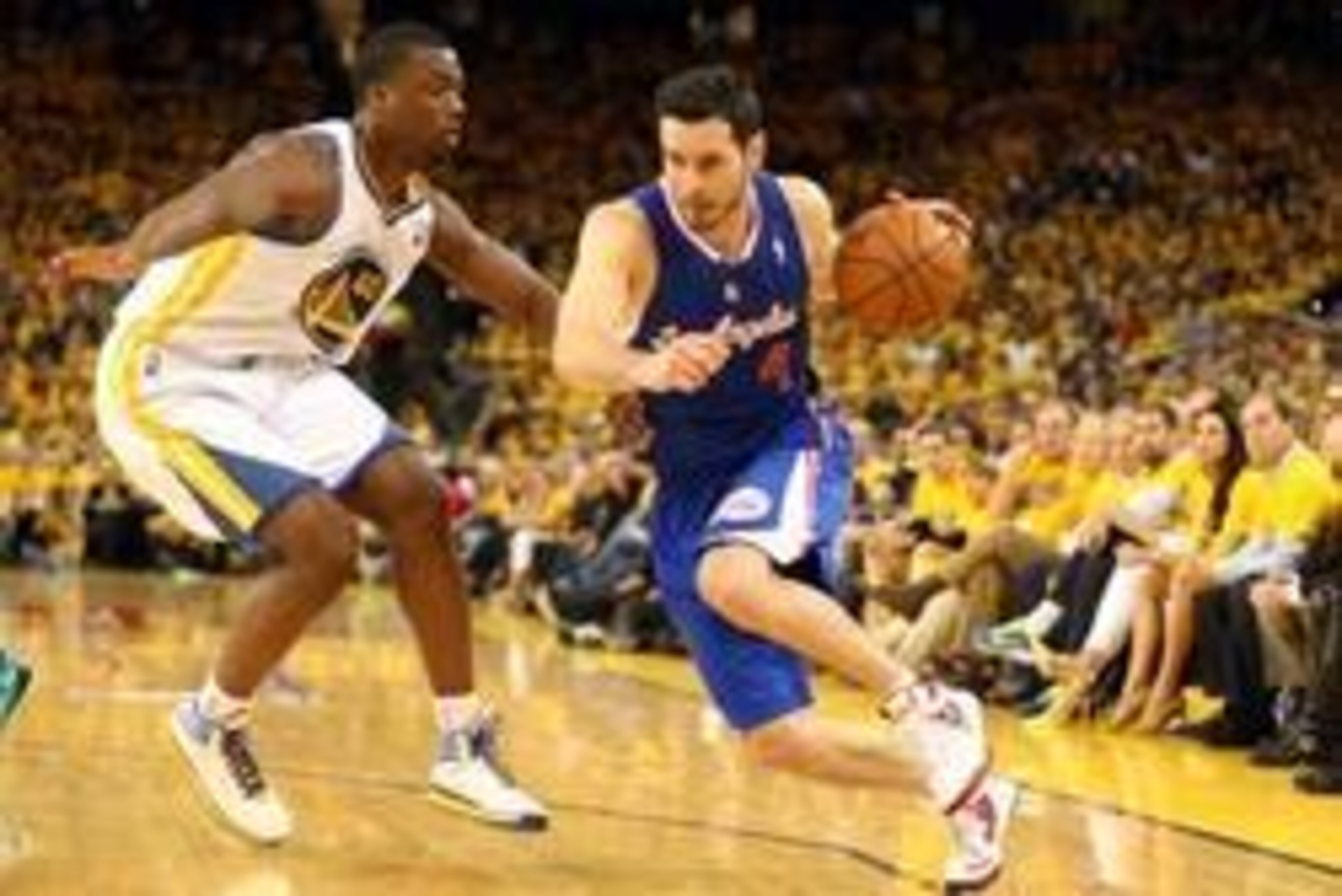 Apr 24, 2014; Oakland, CA, USA; Los Angeles Clippers guard J.J. Redick (4) drives in against Golden State Warriors forward Harrison Barnes (40) during the third quarter of game three of the first round of the 2014 NBA Playoffs at Oracle Arena. The Los Ang