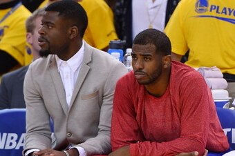 OAKLAND, CA - APRIL 27:  Chris Paul #3 of the Los Angeles Clippers sits on the bench wearing his warm-up top inside out against the Golden State Warriors in Game Four of the Western Conference Quarterfinals during the 2014 NBA Playoffs at ORACLE Arena on 