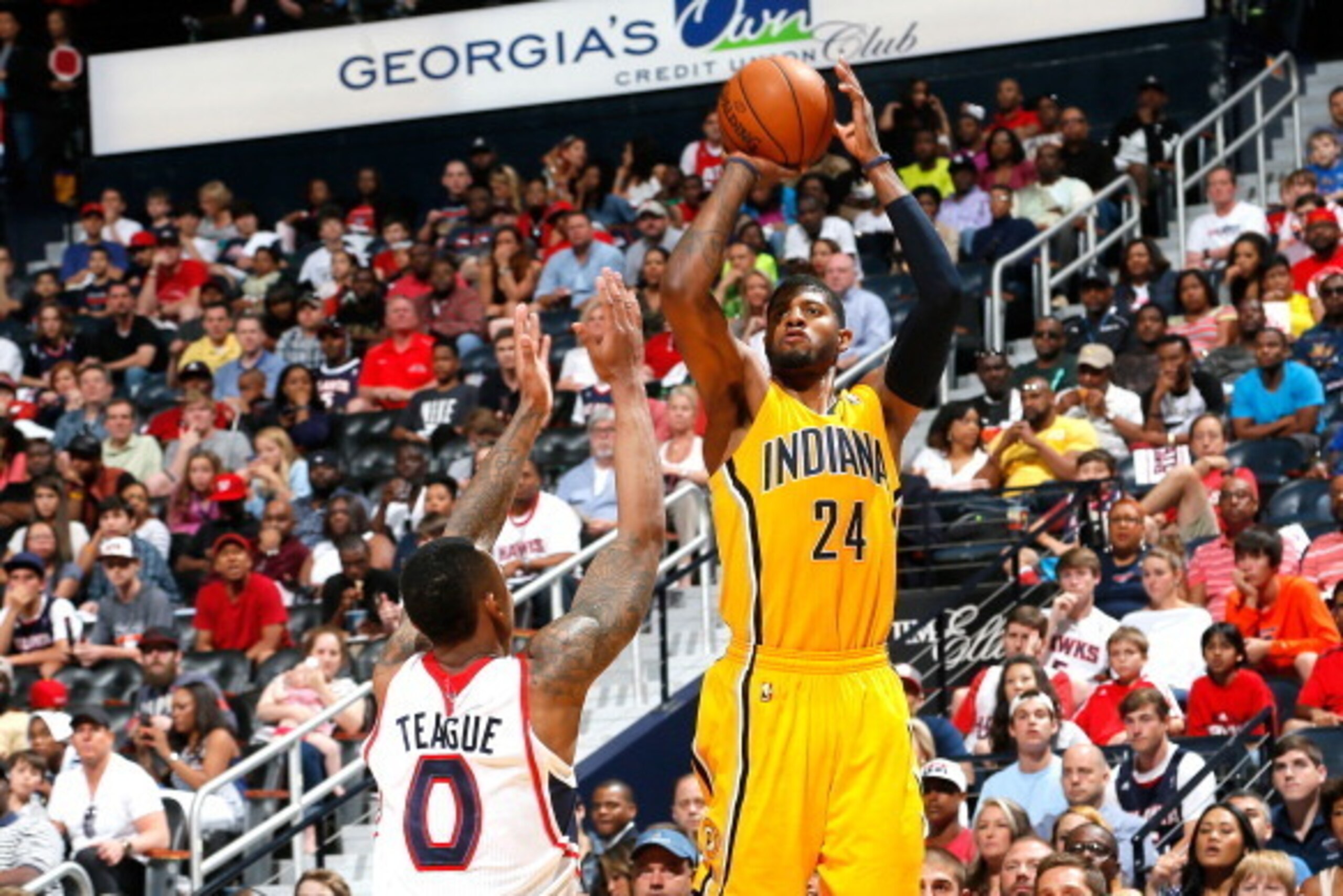 ATLANTA, GA - APRIL 26:  Paul George #24 of the Indiana Pacers shoots a three-point basket against Jeff Teague #0 of the Atlanta Hawks in Game Four of the Eastern Conference Quarterfinals during the 2014 NBA Playoffs at Philips Arena on April 26, 2014 in 