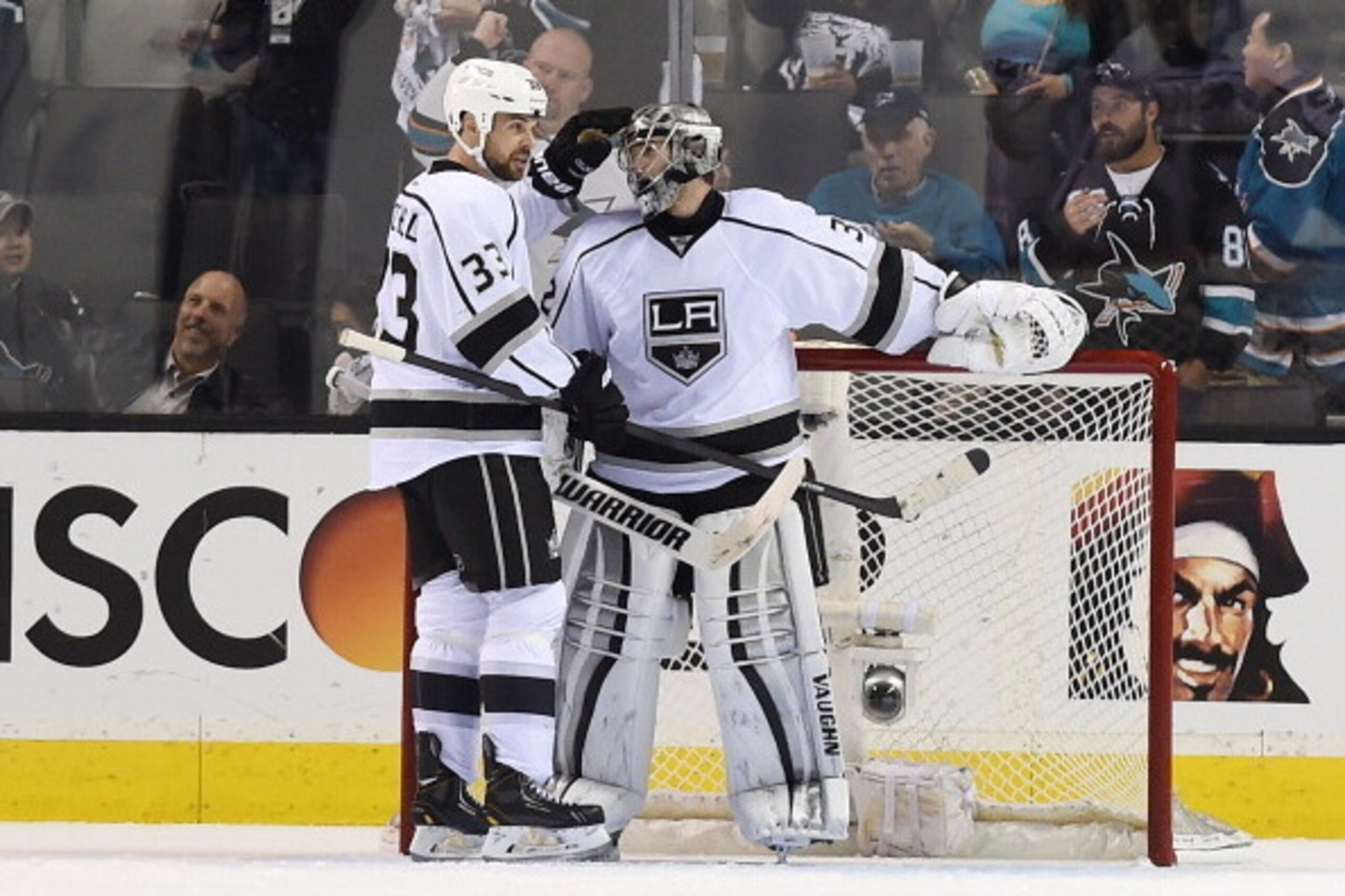 SAN JOSE, CA - APRIL 26:  Willie Mitchell #33 of the Los Angeles Kings congratulates goalkeeper Jonathan Quick #32 on shutting out the San Jose Sharks 3-0 in Game Five of the First Round of the 2014 NHL Stanley Cup Playoffs at SAP Center on April 26, 2014