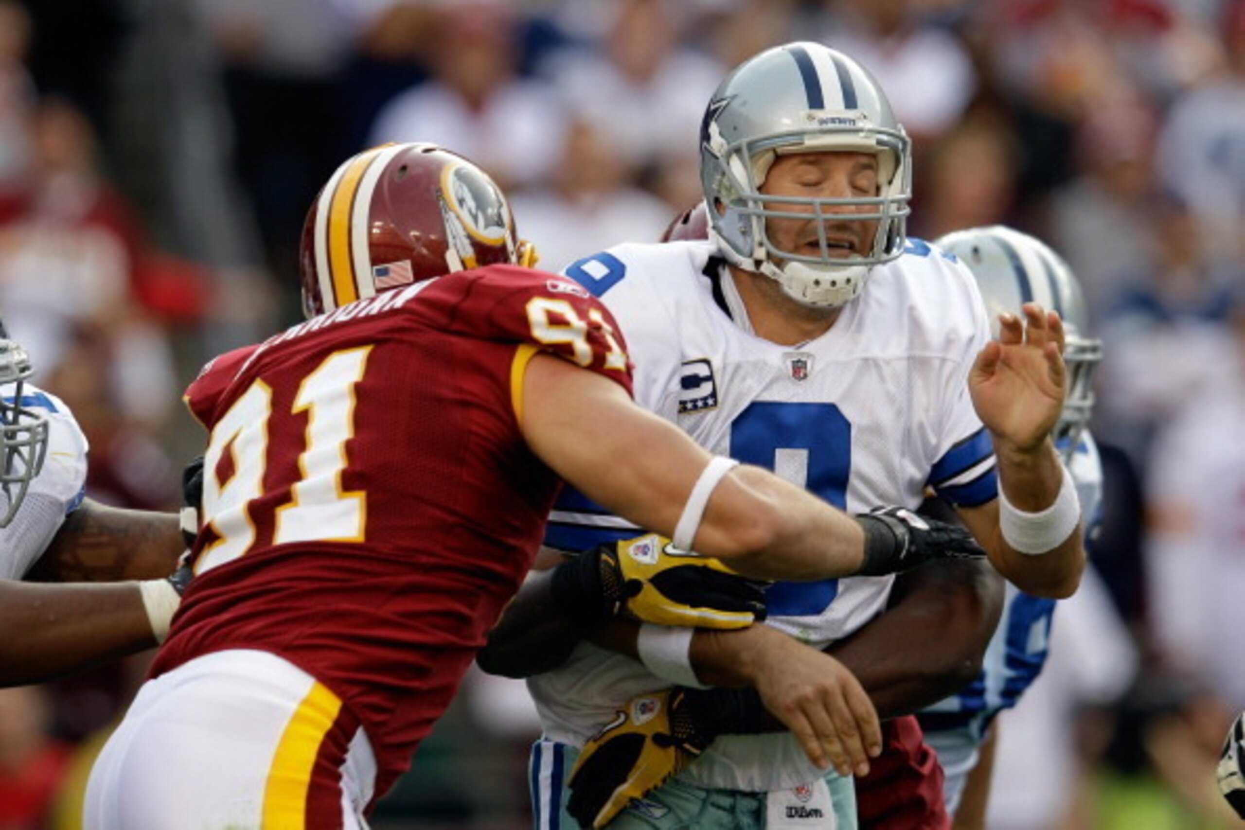 LANDOVER, MD - NOVEMBER 20:  Ryan Kerrigan #91 of the Washington Redskins hits  Tony Romo #9 of the Dallas Cowboys after Romo threw a pass during the second half at FedExField on November 20, 2011 in Landover, Maryland.  (Photo by Rob Carr/Getty Images)