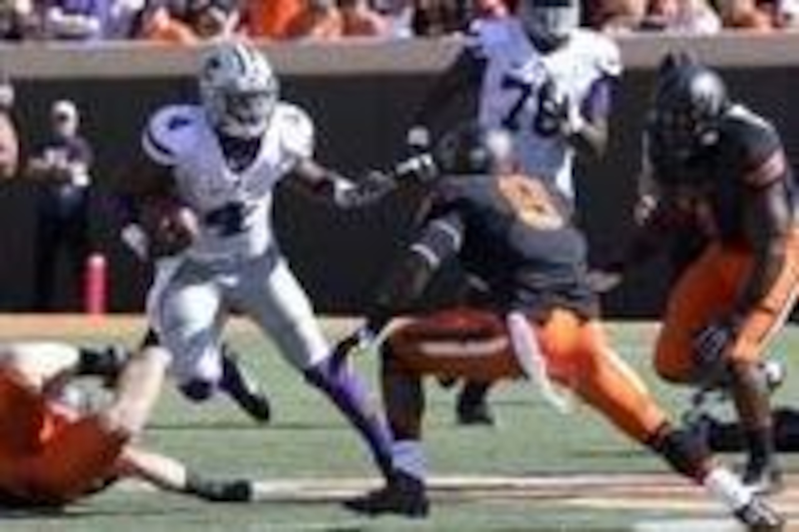 Oct 5, 2013; Stillwater, OK, USA;  Kansas State Wildcats quarterback Daniel Sams (4) runs for yardage against the Oklahoma State Cowboys during the first quarter at Boone Pickens Stadium. Mandatory Credit: Richard Rowe-USA TODAY Sports
