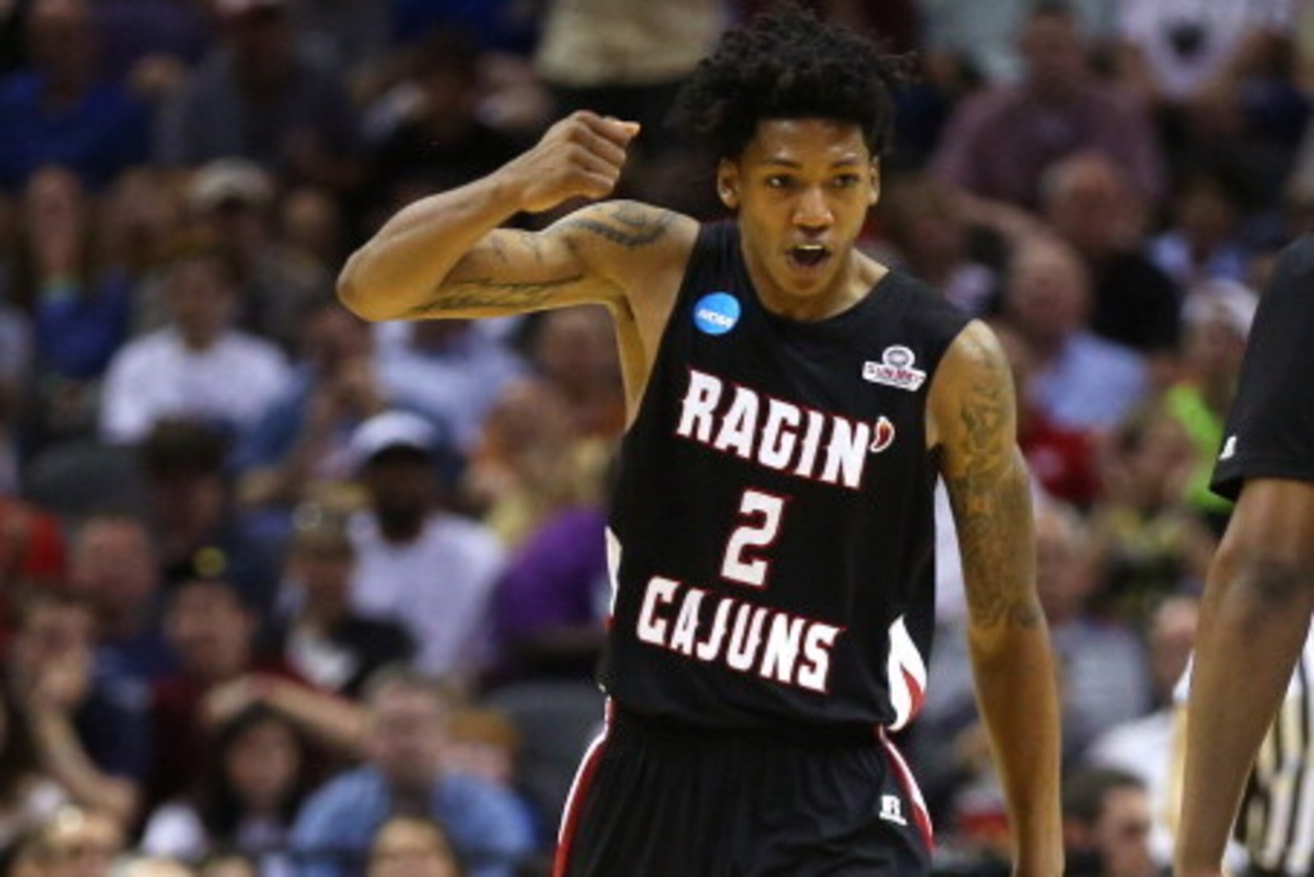 SAN ANTONIO, TX - MARCH 21:  Elfrid Payton #2 of the Louisiana Lafayette Ragin Cajuns celebrates after a play in the second half against the Creighton Bluejays during the second round of the 2014 NCAA Men's Basketball Tournament at AT&T Center on March 21
