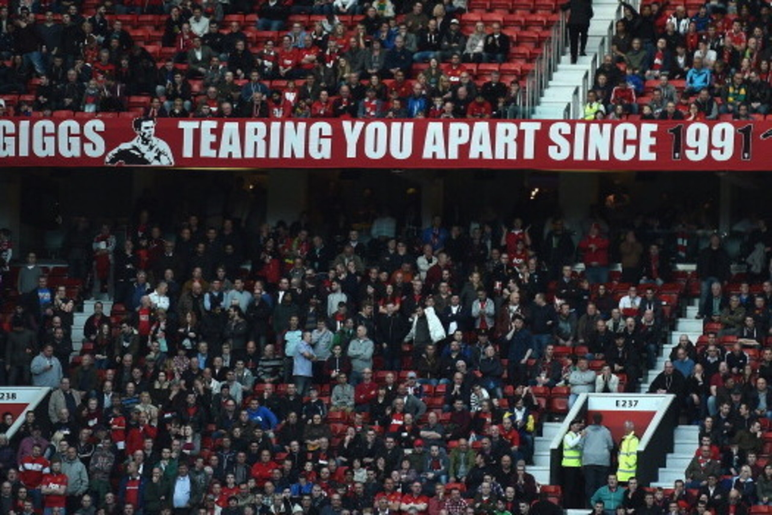 MANCHESTER, ENGLAND - APRIL 26: A banner showing support of Ryan Giggs during the Barclays Premier League match between Manchester United and Norwich City at Old Trafford on April 26, 2014 in Manchester, England. (Photo by Laurence Griffiths/Getty Image MANCHESTER, ENGLAND - APRIL 26: A banner showing support of Ryan Giggs during the Barclays Premier League match between Manchester United and Norwich City at Old Trafford on April 26, 2014 in Manchester, England. (Photo by Laurence Griffiths/Getty Image