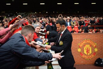 MANCHESTER, ENGLAND - APRIL 26:  Ryan Giggs of Manchester United signs autographs during the Barclays Premier League match between Manchester United and Norwich City at Old Trafford on April 26, 2014 in Manchester, England.  (Photo by Laurence Griffiths/G