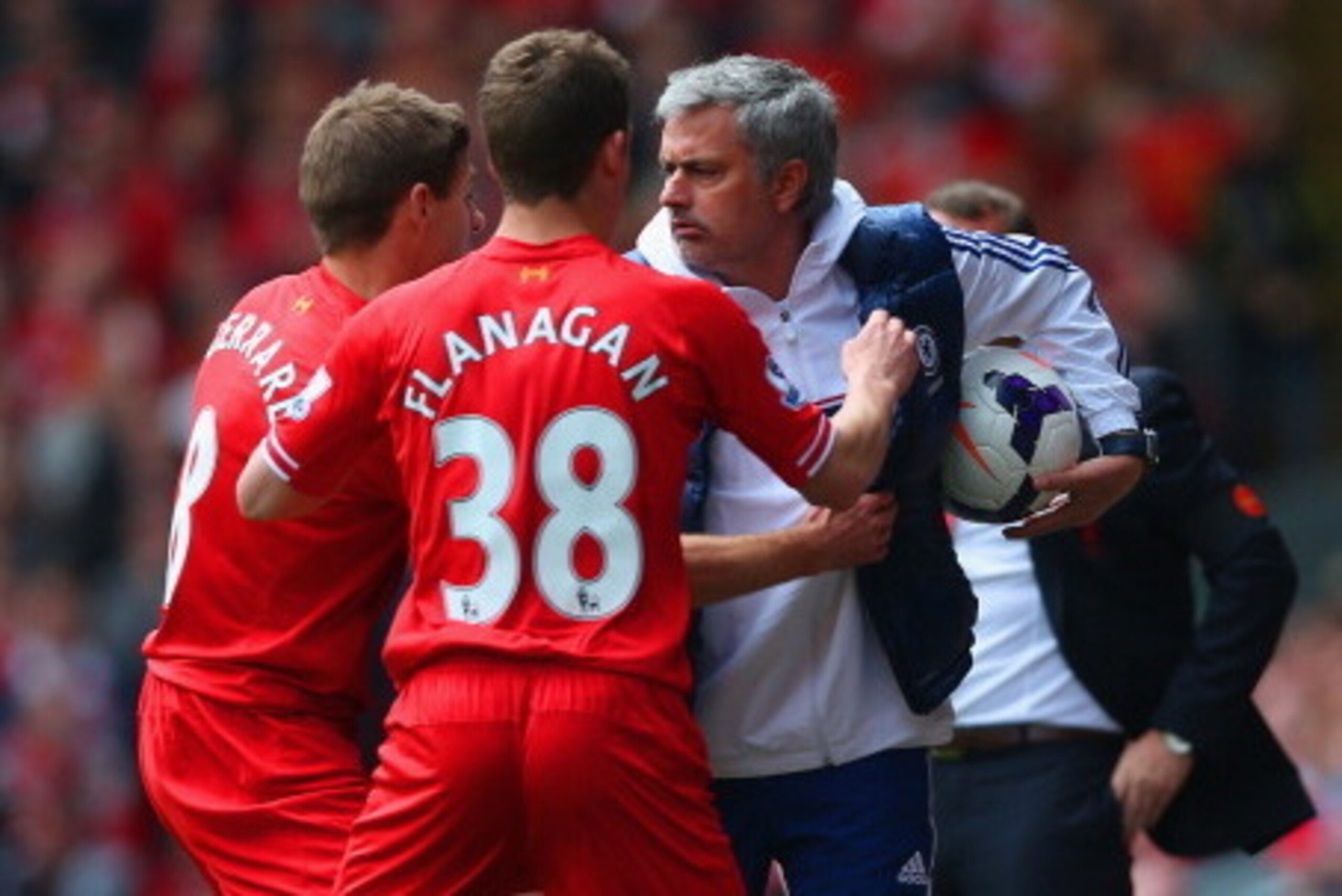 LIVERPOOL, ENGLAND - APRIL 27:  Steven Gerrard and Jon Flanagan of Liverpool have words with Jose Mourinho manager of Chelsea during the Barclays Premier League match between Liverpool and Chelsea at Anfield on April 27, 2014 in Liverpool, England.  (Phot