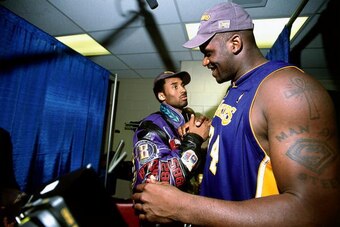 PHILADELPHIA - JUNE 2001:  Kobe Bryant #8 and Shaquille O'Neal #34 of the Los Angeles Lakers celebrate after winning the 2001 NBA Championship against the Philadelphia 76'ers circa June 2001 at the First Union Center in Philadelphia, Pennsylvania. NOTE TO