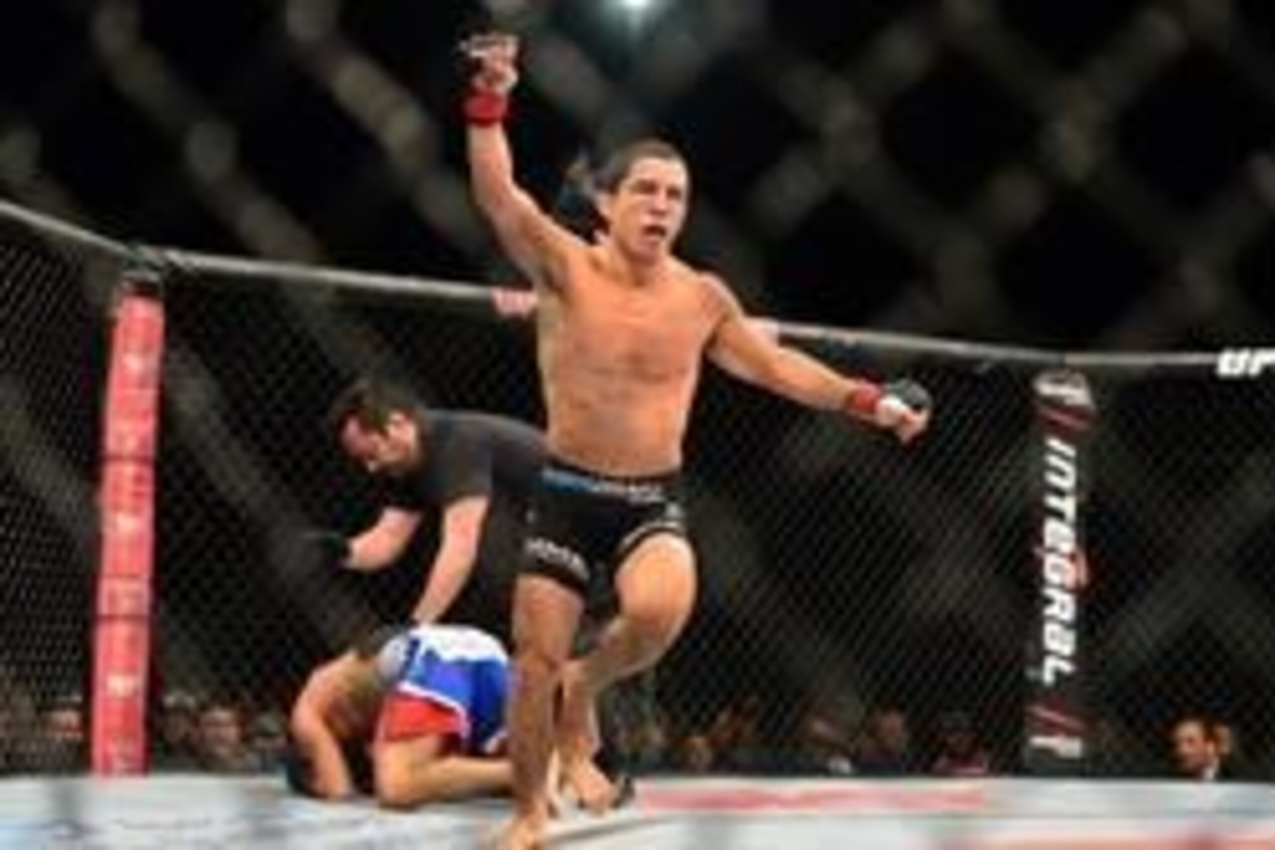 Sep 4, 2013; Belo Horizonte, BRAZIL;  Joseph Benavidez (black shorts) reacts after defeating Jussier Formiga during UFC Fight Night at Mineirinho Arena. Mandatory Credit: Jason Silva-USA TODAY Sports