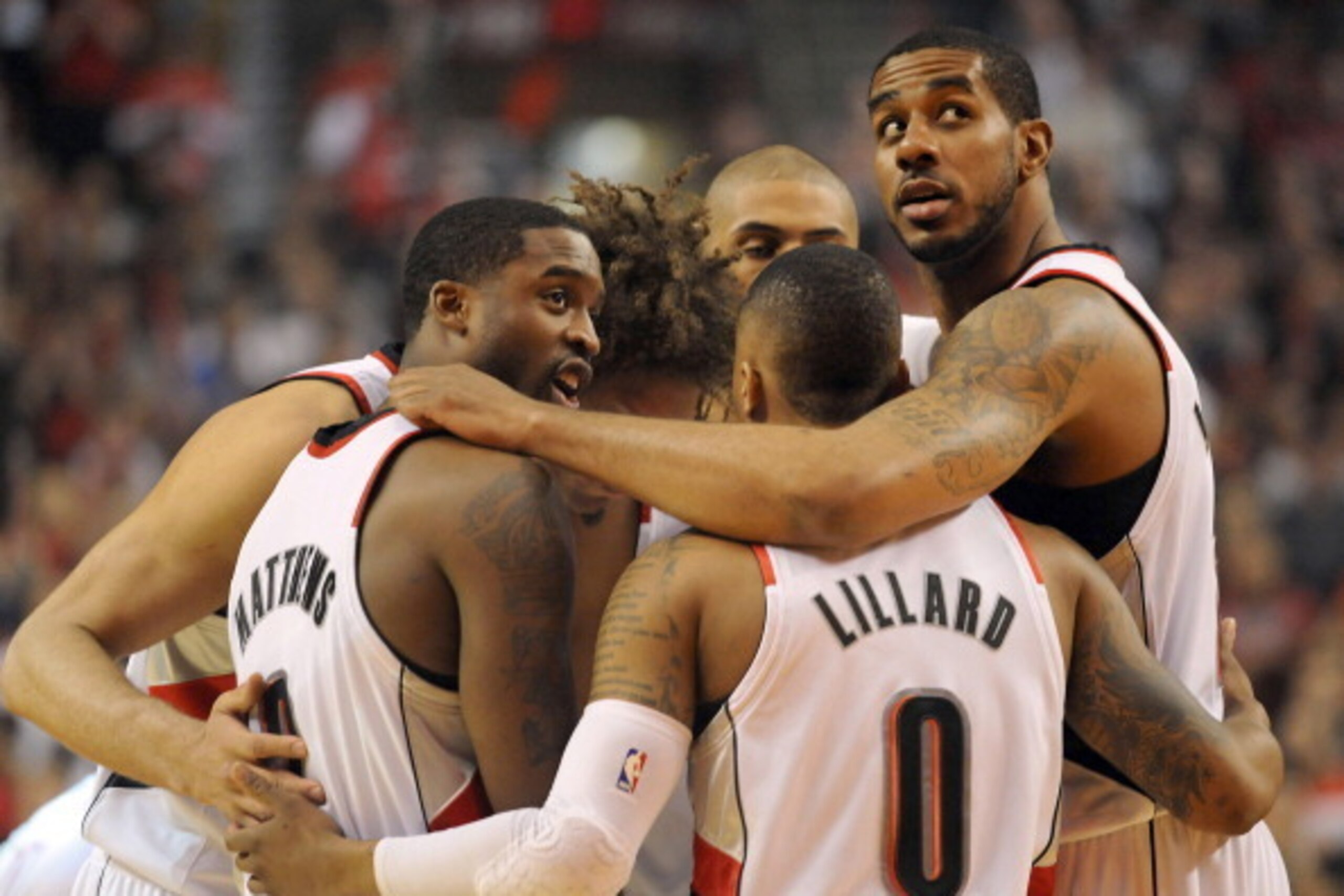 PORTLAND, OR - APRIL  25: Portland Trail Blazers starting five, Wesley Matthews #2, Damian Lillard #0, LaMarcus Aldridge #12, Nicolas Batum #88 and Robin Lopez #42 huddle before Game Three of the Western Conference Quarterfinals against the Houston Rocket