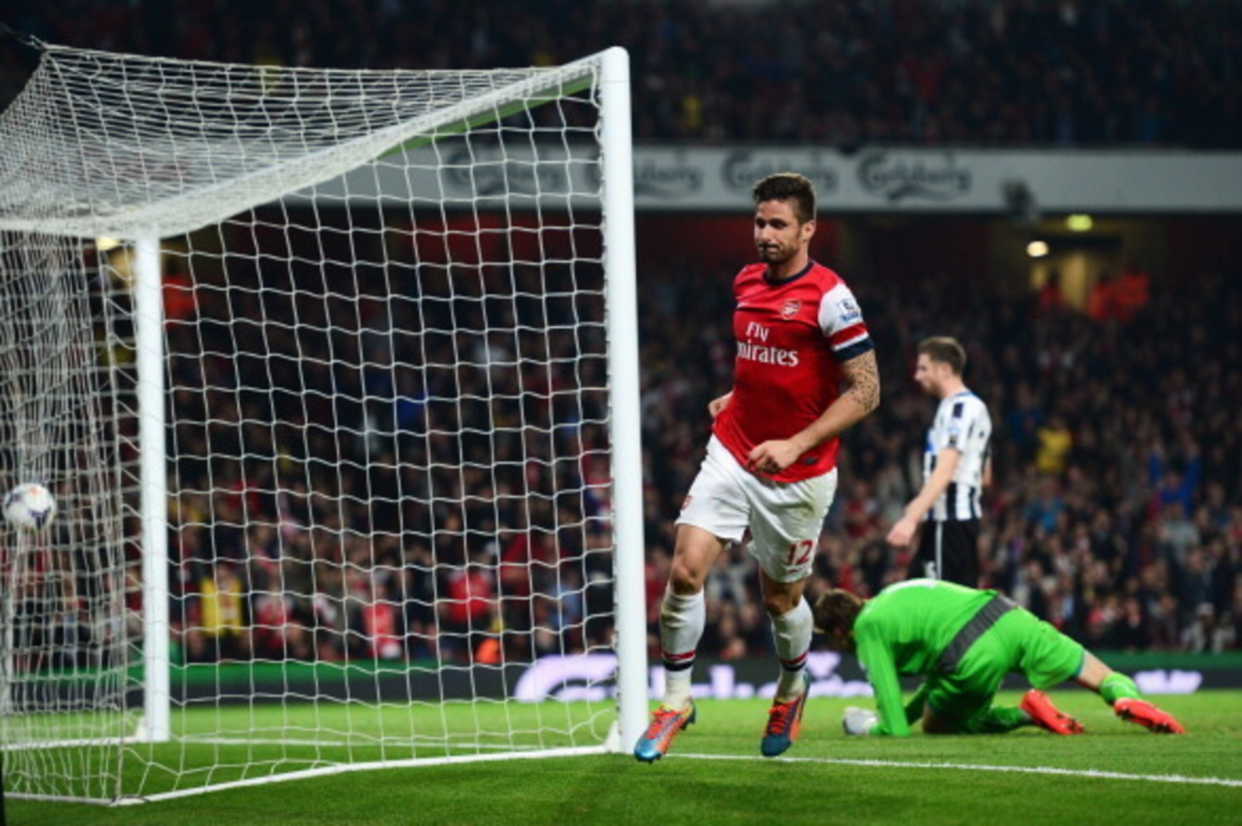 LONDON, ENGLAND - APRIL 28:  Olivier Giroud of Arsenal celebrates as he scores their third goal during the Barclays Premier League match between Arsenal and Newcastle United at Emirates Stadium on April 28, 2014 in London, England.  (Photo by Jamie McDona
