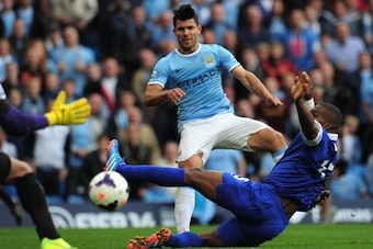 MANCHESTER, ENGLAND - OCTOBER 05: Sergio Aguero of Manchester City shoots past Sylvain Distin (R) and Tim Howard (L) of Everton to score his team's second goal during the Barclays Premier League match between Manchester City and Everton at Etihad Stadium MANCHESTER, ENGLAND - OCTOBER 05: Sergio Aguero of Manchester City shoots past Sylvain Distin (R) and Tim Howard (L) of Everton to score his team's second goal during the Barclays Premier League match between Manchester City and Everton at Etihad Stadium