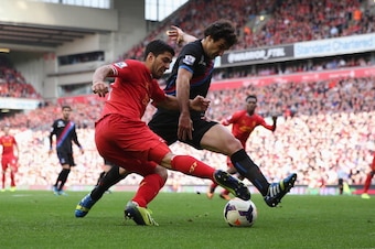 LIVERPOOL, ENGLAND - OCTOBER 05: Luis Suarez of Liverpool in action with Mile Jedinak of Crystal Palace during the Barclays Premier League match between Liverpool and Crystal Palace at Anfield on October 5, 2013 in Liverpool, England. (Photo by Clive Br LIVERPOOL, ENGLAND - OCTOBER 05: Luis Suarez of Liverpool in action with Mile Jedinak of Crystal Palace during the Barclays Premier League match between Liverpool and Crystal Palace at Anfield on October 5, 2013 in Liverpool, England. (Photo by Clive Br