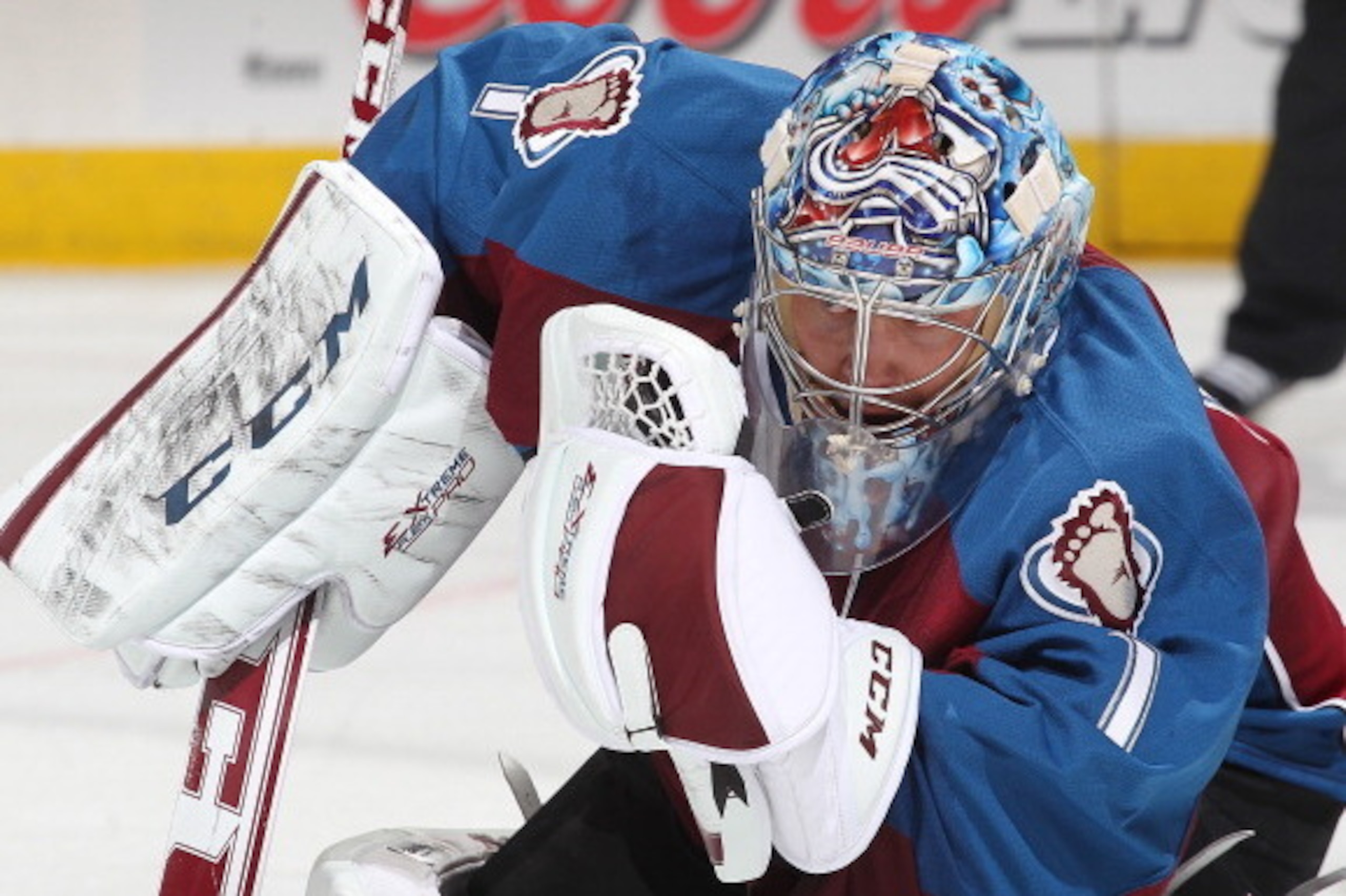 DENVER, CO - MARCH 21: Goaltender Semyon Varlamov #1 of the Colorado Avalanche makes a glove save against the Boston Bruins at the Pepsi Center on March 21, 2014 in Denver, Colorado.  (Photo by Michael Martin/NHLI via Getty Images)