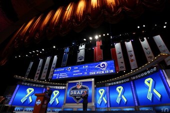 NEW YORK, NY - APRIL 25:  Former New England Patriots player Joe Andruzzi stands at the pdium as talks about the Bombing which occured during thir years Boston Marathon in the first round of the 2013 NFL Draft at Radio City Music Hall on April 25, 2013 in