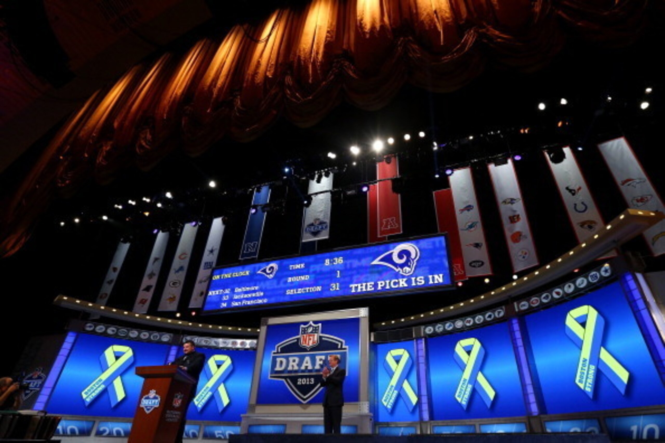 NEW YORK, NY - APRIL 25:  Former New England Patriots player Joe Andruzzi stands at the pdium as talks about the Bombing which occured during thir years Boston Marathon in the first round of the 2013 NFL Draft at Radio City Music Hall on April 25, 2013 in