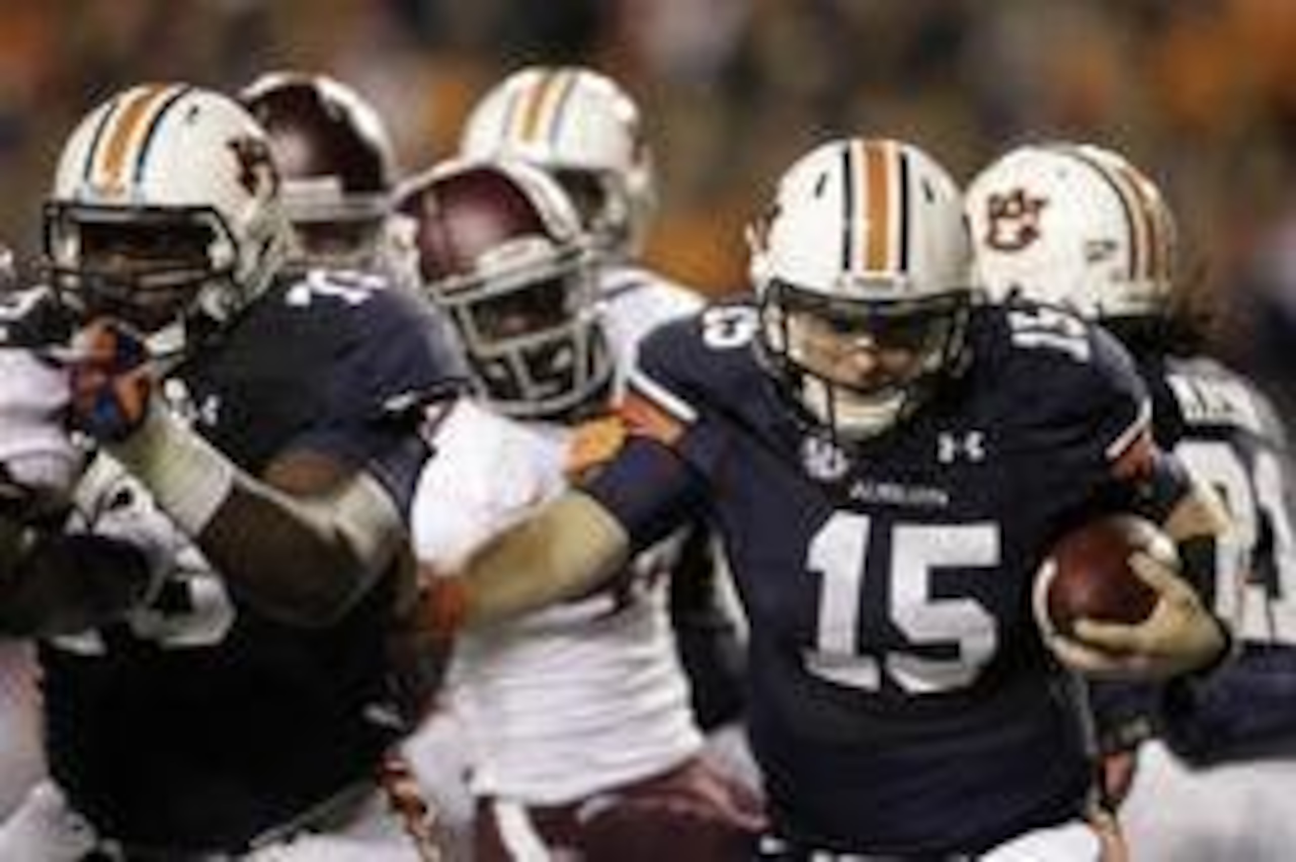 Oct 27, 2012; Auburn, AL, USA: Auburn Tigers quarterback Clint Moseley (15) runs behind the block of lineman Greg Robinson (73) during the first half against the Texas A&M Aggies at Jordan-Hare Stadium.  Mandatory Credit: John Reed-USA TODAY Sports
