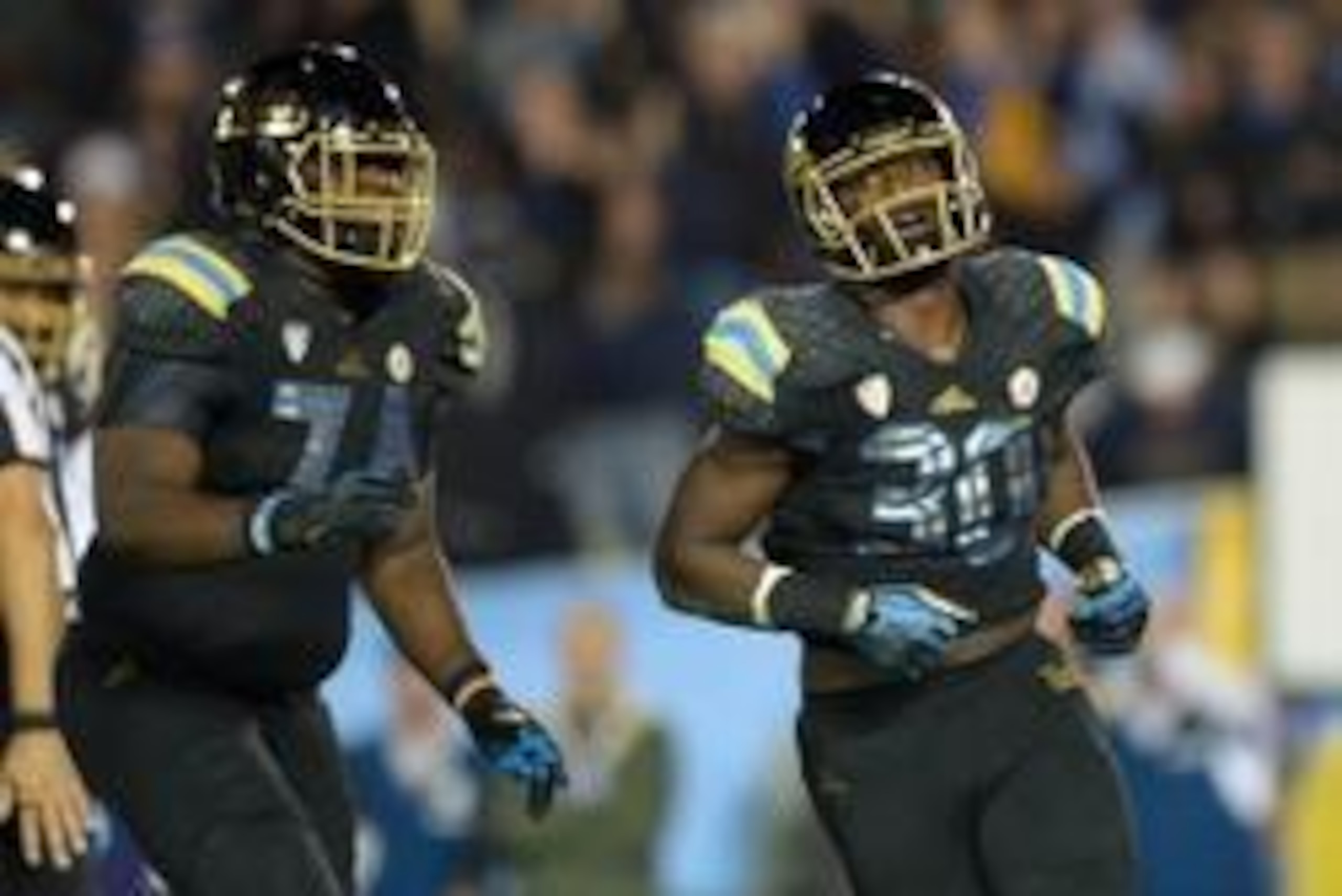 Nov 15, 2013; Pasadena, CA, USA; UCLA Bruins running back Myles Jack (30) celebrates with offensive lineman Caleb Benenoch (74) after scoring on a 2-yard touchdown run in the third quarter for his fourth touchdown against the Washington Huskies at Rose Bo